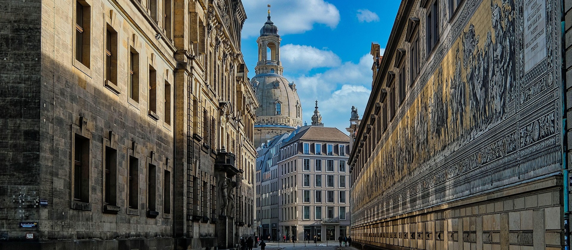 an abstract photo of a curved building with a blue sky in the background