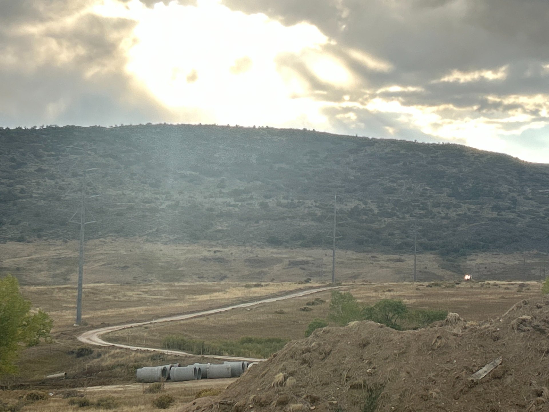 an abstract photo of a curved building with a blue sky in the background