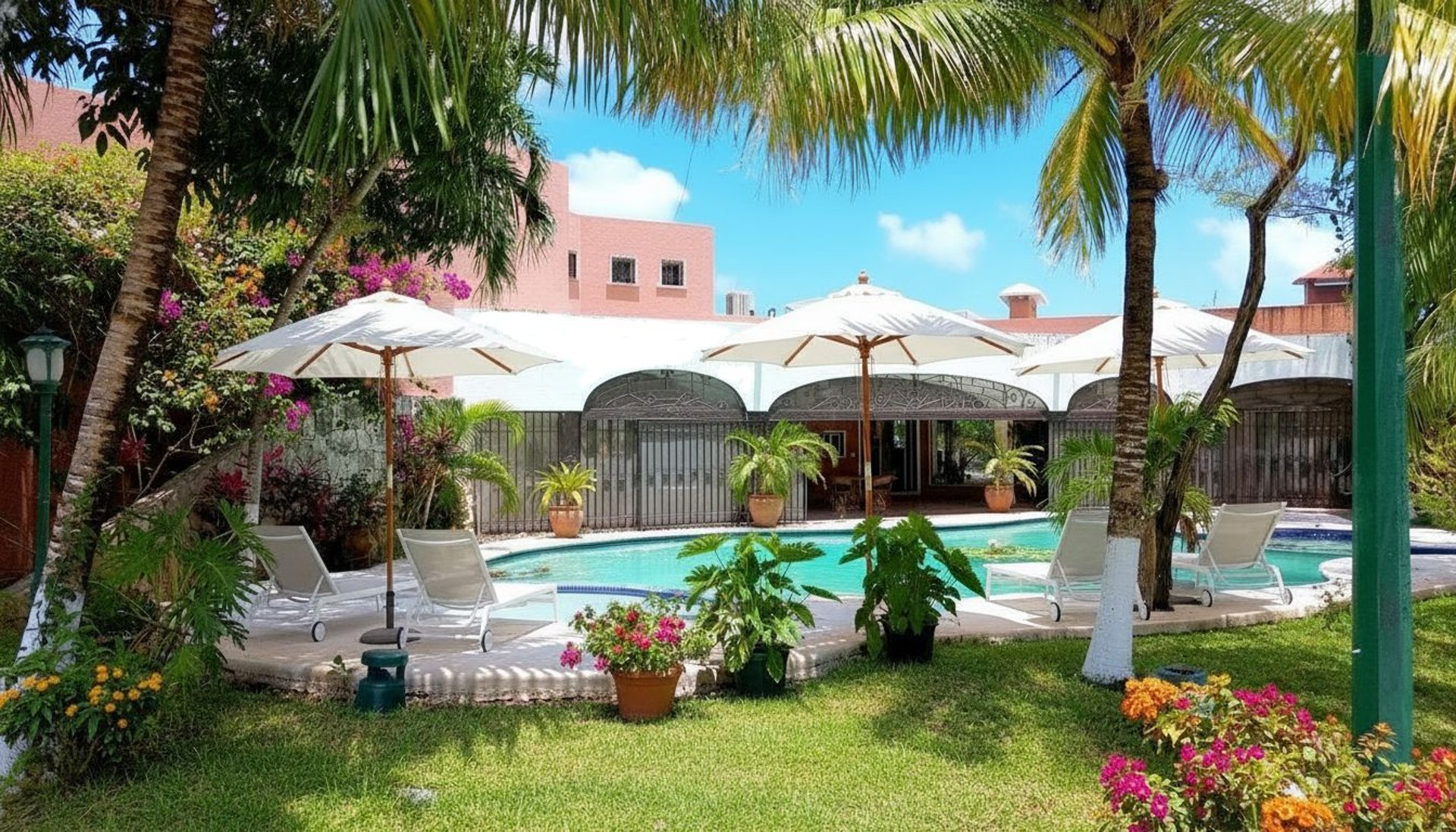 a couple of lawn chairs sitting next to a swimming pool