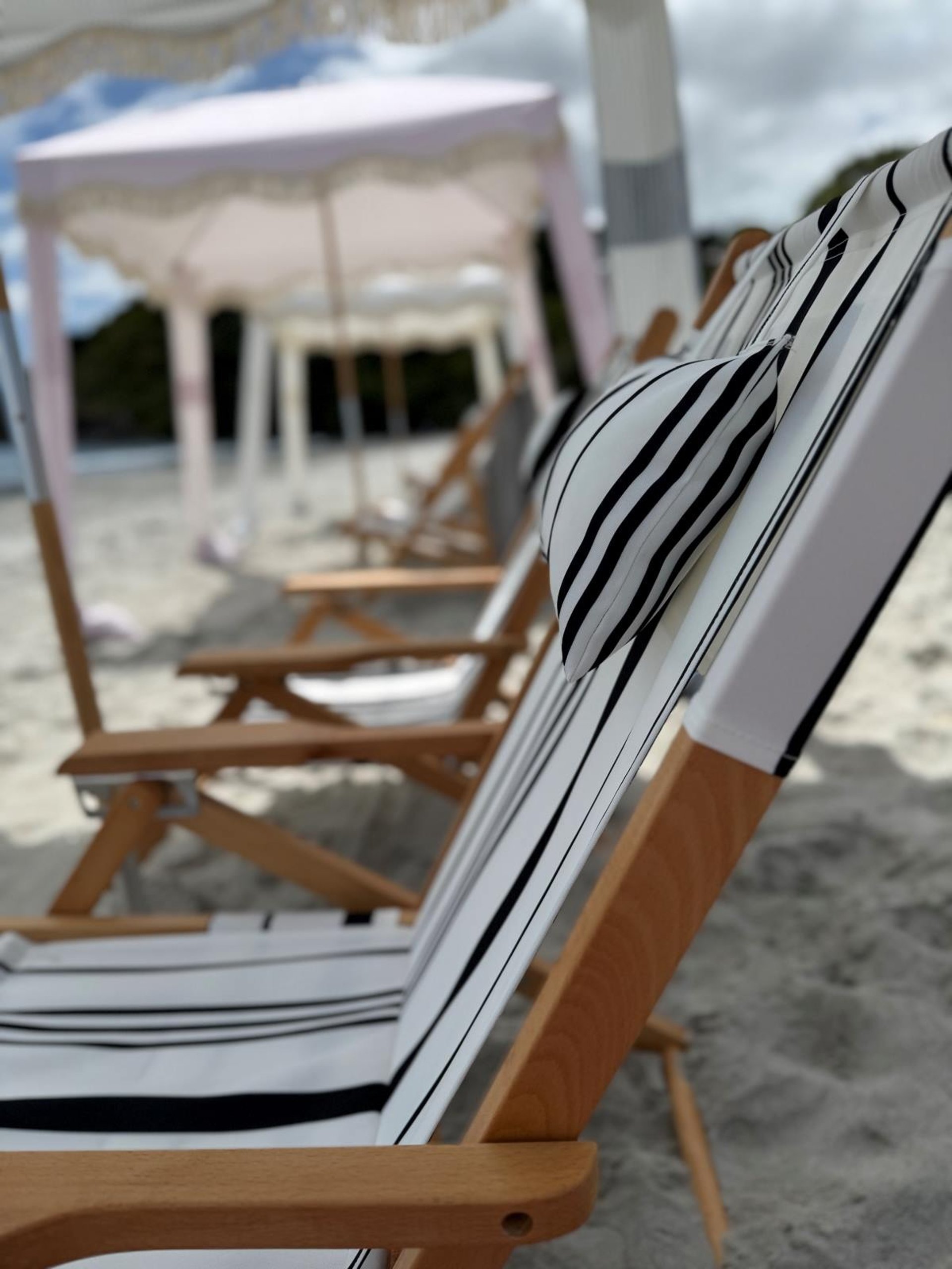an abstract photo of a curved building with a blue sky in the background