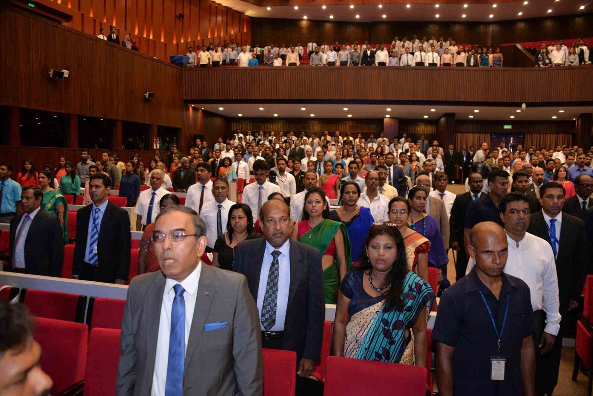 person wearing grey dress shirt beside table