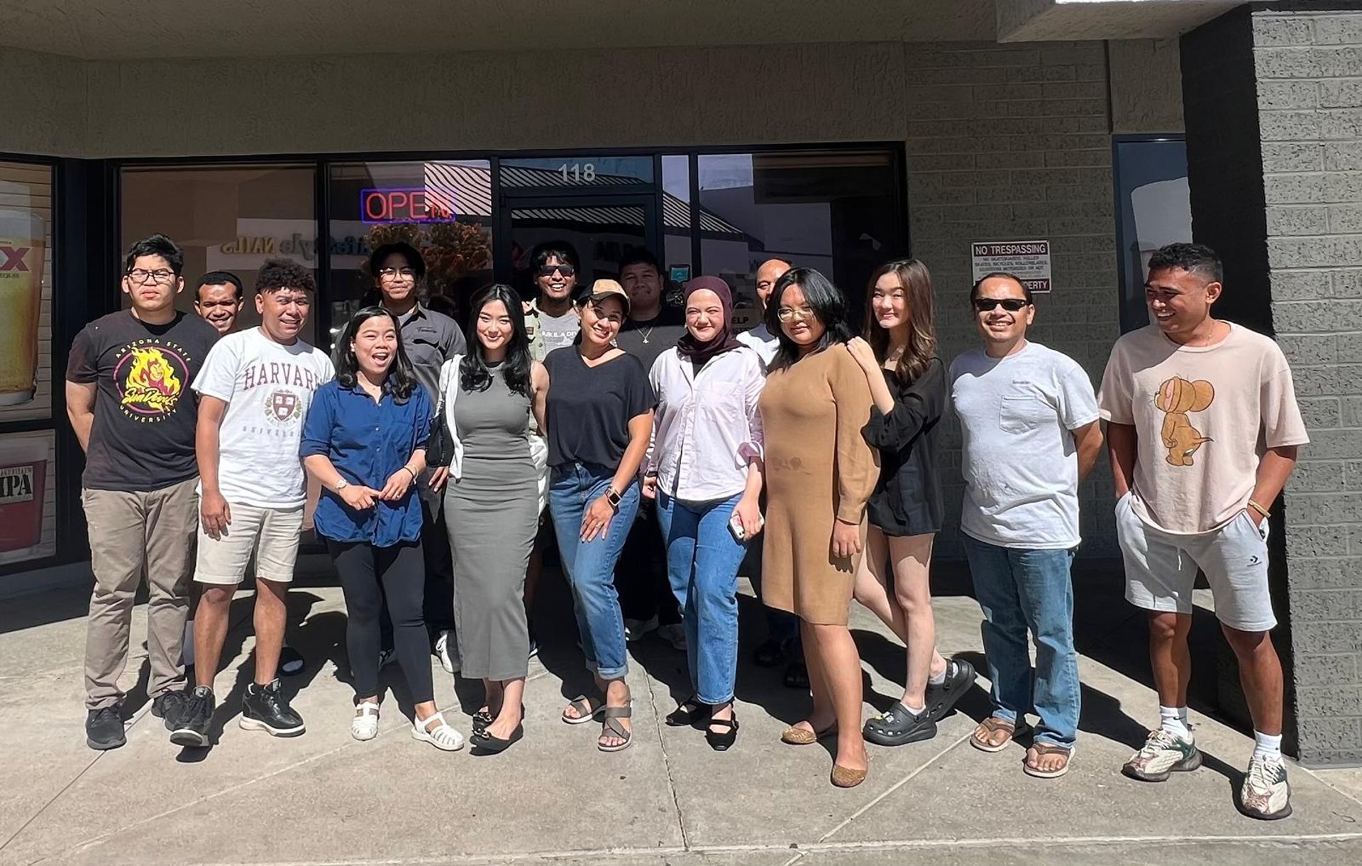 woman wearing yellow long-sleeved dress under white clouds and blue sky during daytime