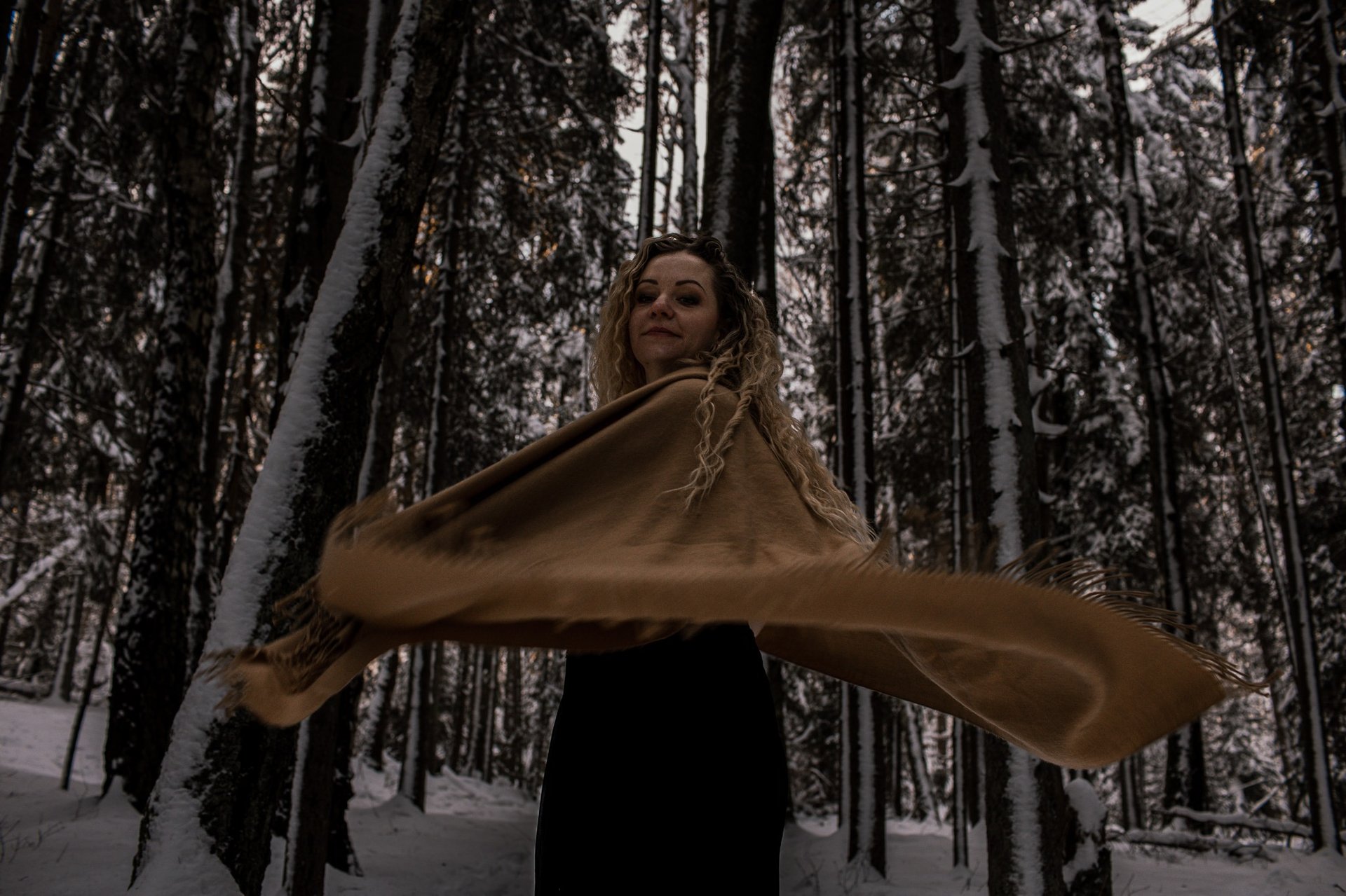 woman wearing yellow long-sleeved dress under white clouds and blue sky during daytime