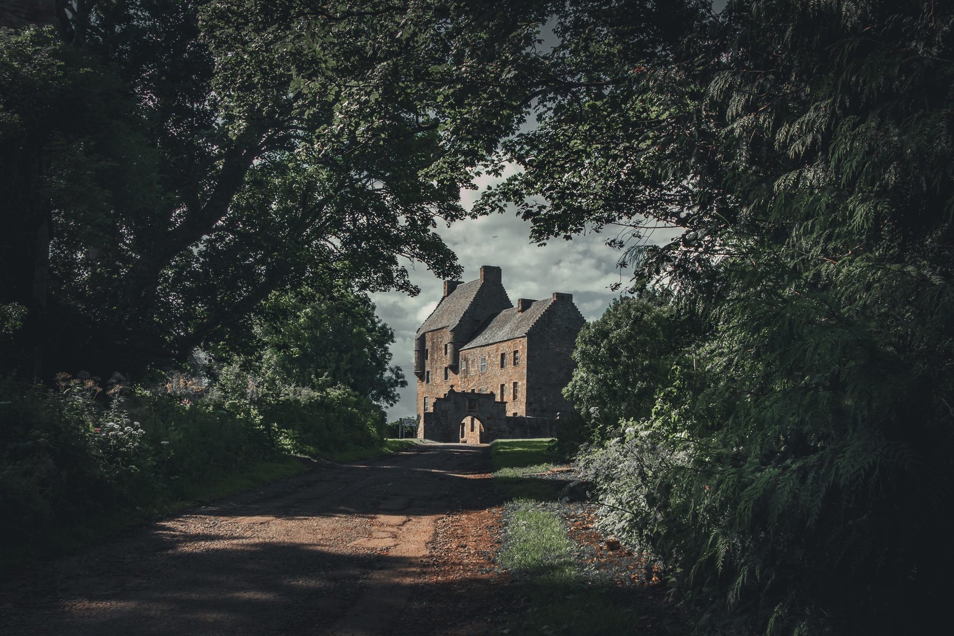 woman wearing yellow long-sleeved dress under white clouds and blue sky during daytime