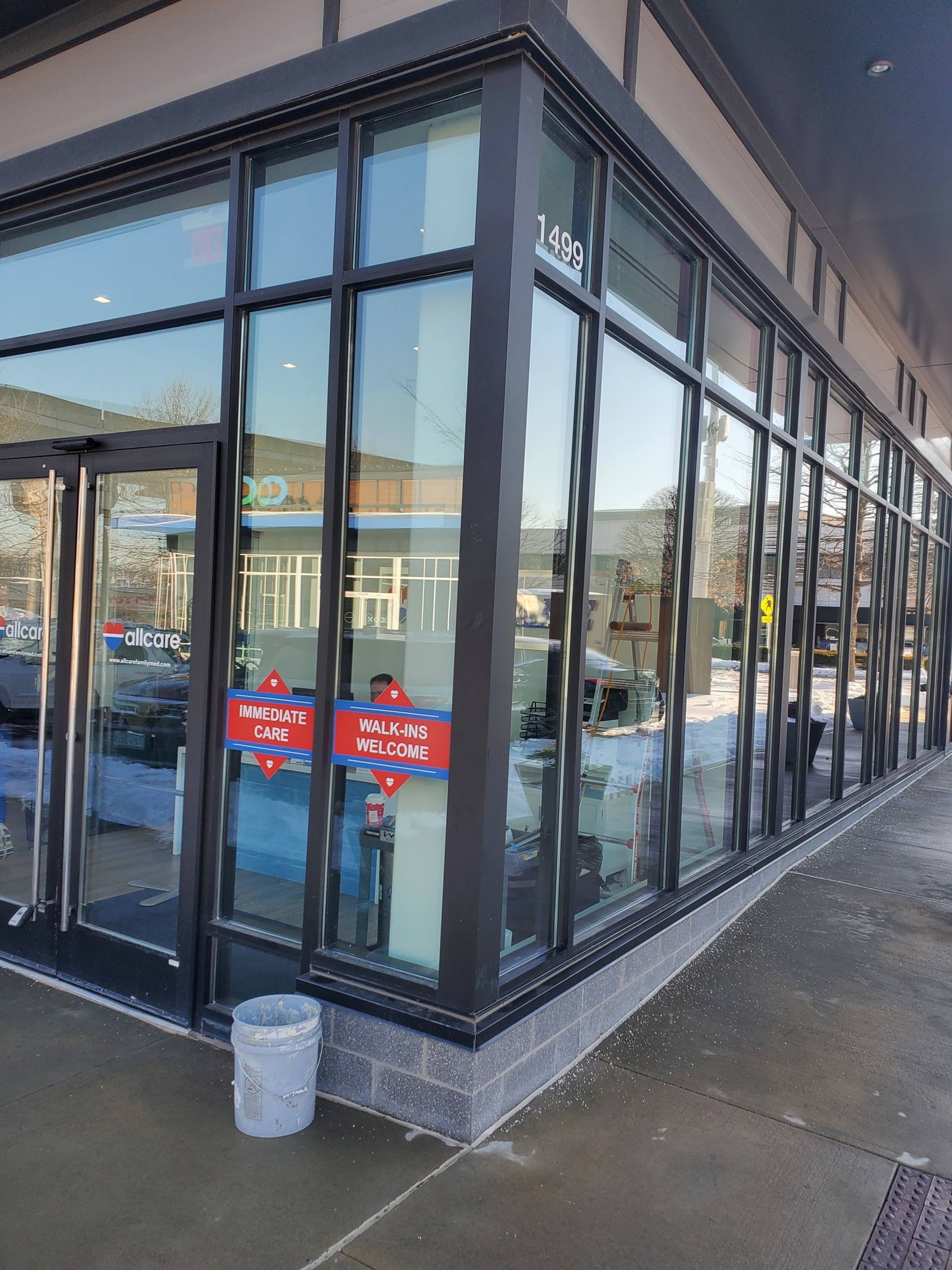 an abstract photo of a curved building with a blue sky in the background