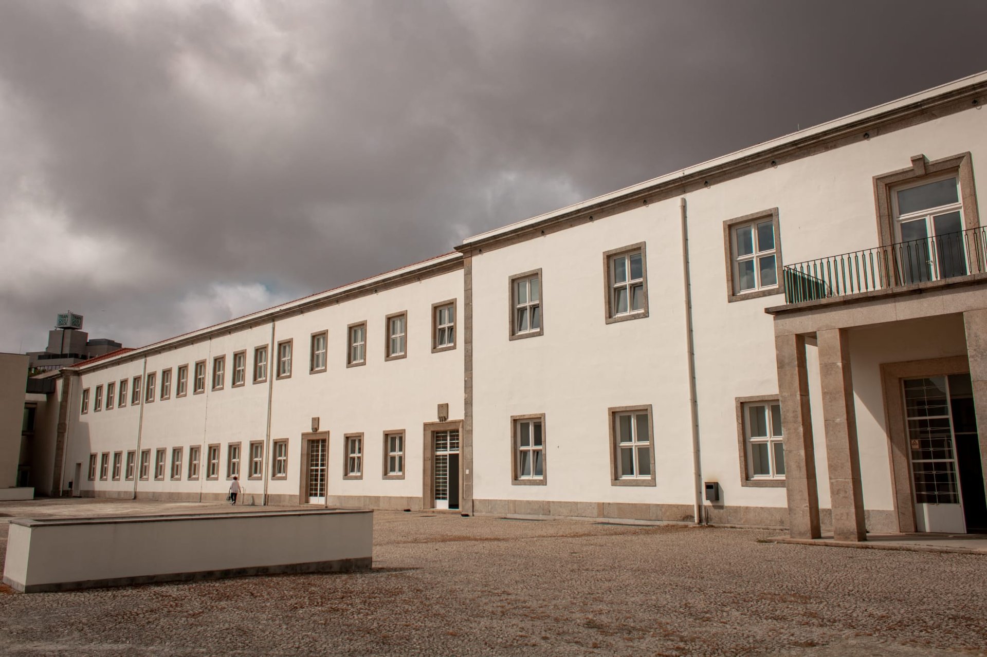 woman wearing yellow long-sleeved dress under white clouds and blue sky during daytime
