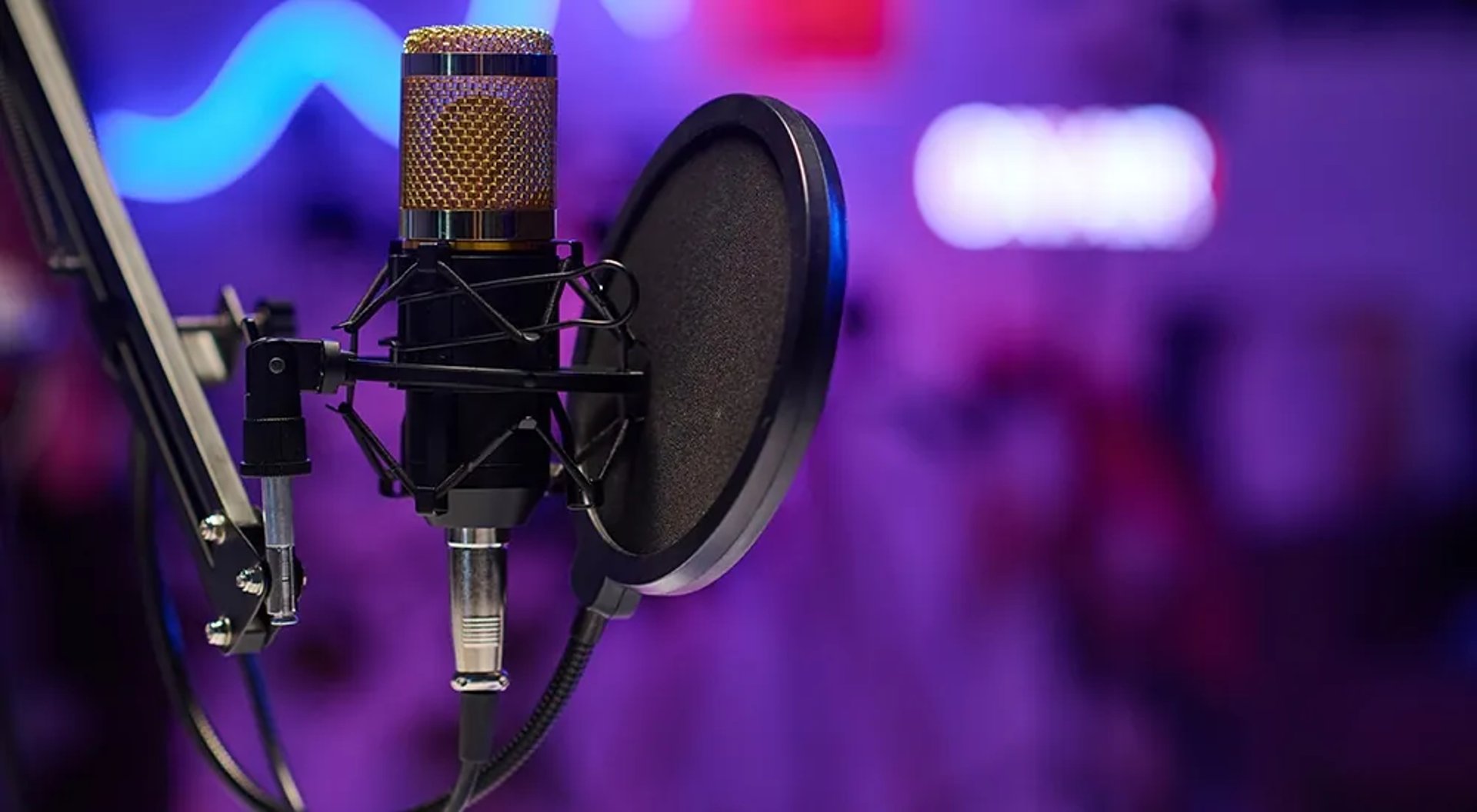 a microphone with a red light shining on it