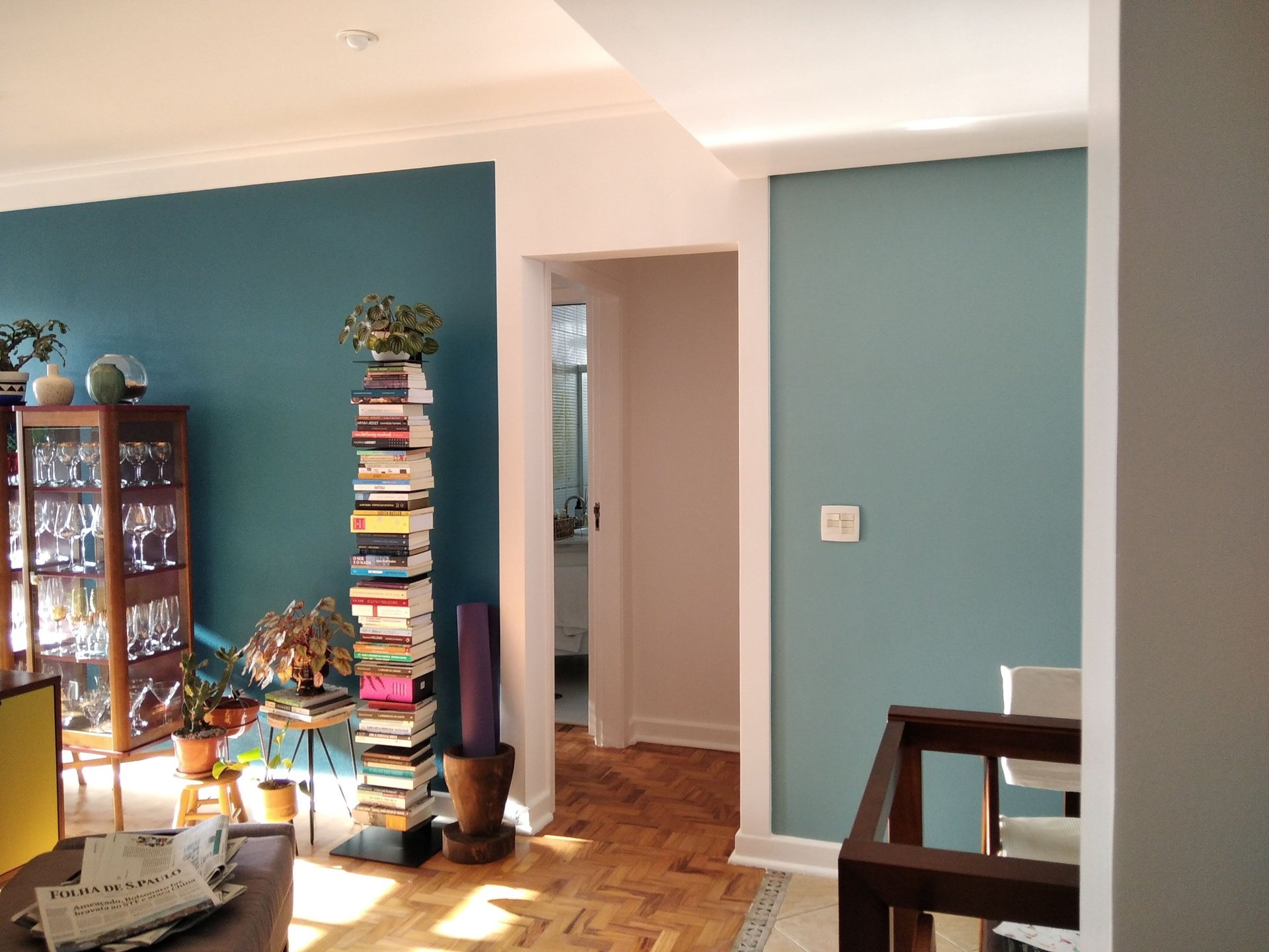 an abstract photo of a curved building with a blue sky in the background