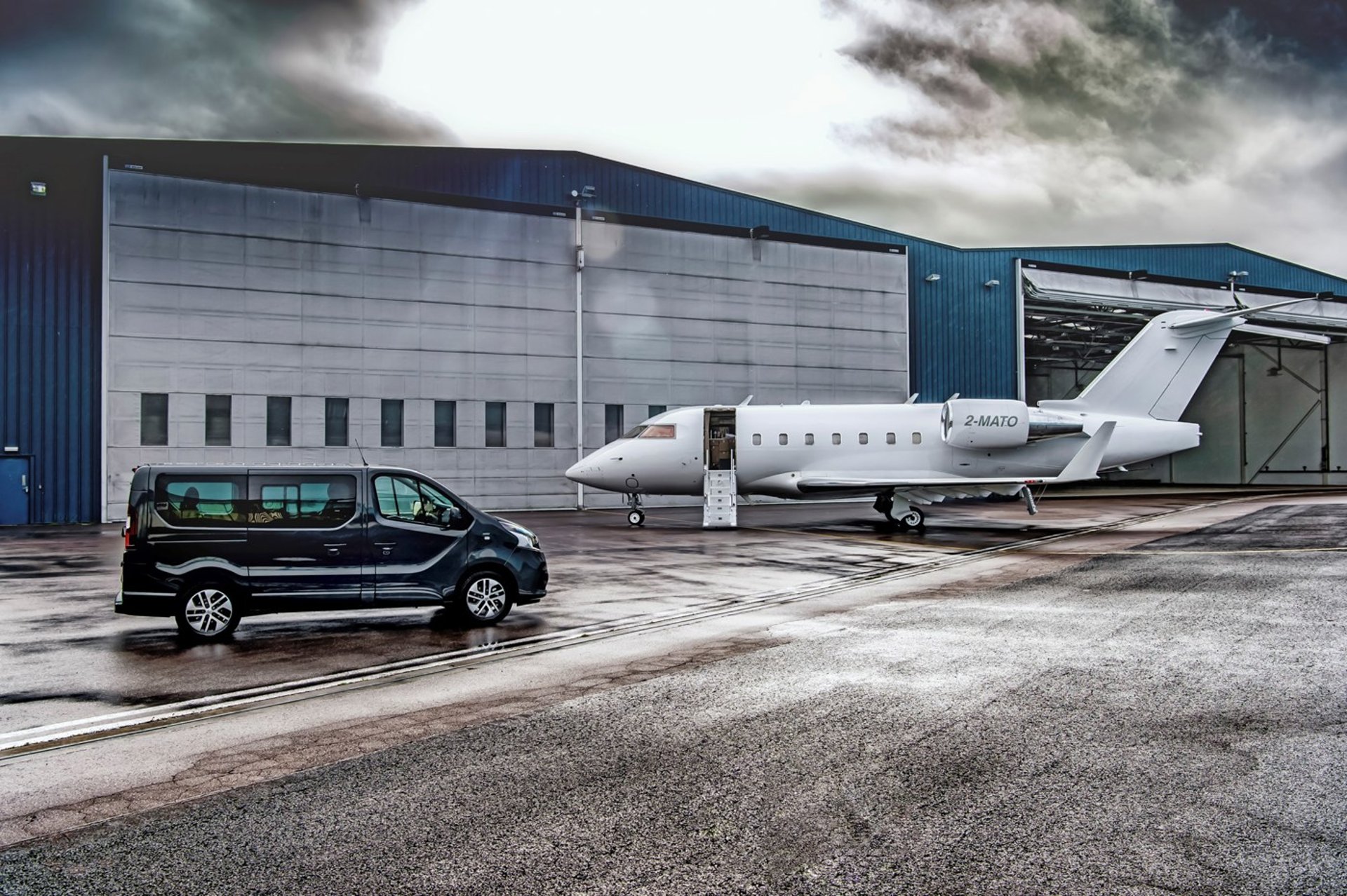 black and brown leather padded tub sofa