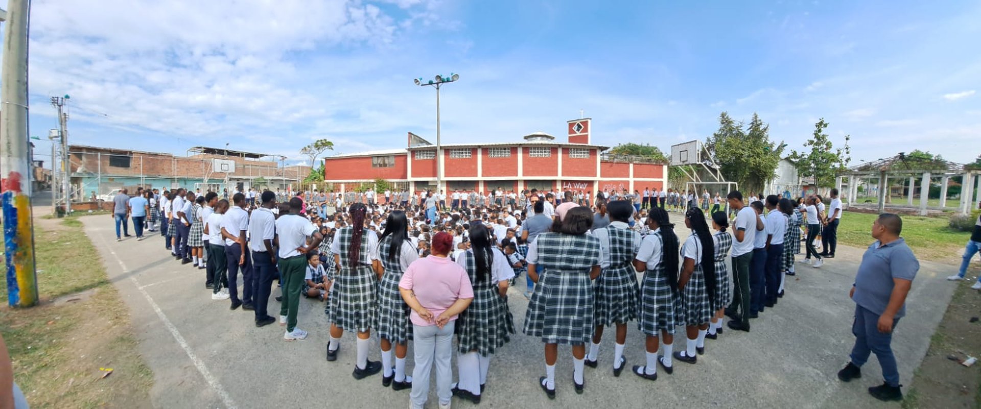 woman wearing yellow long-sleeved dress under white clouds and blue sky during daytime