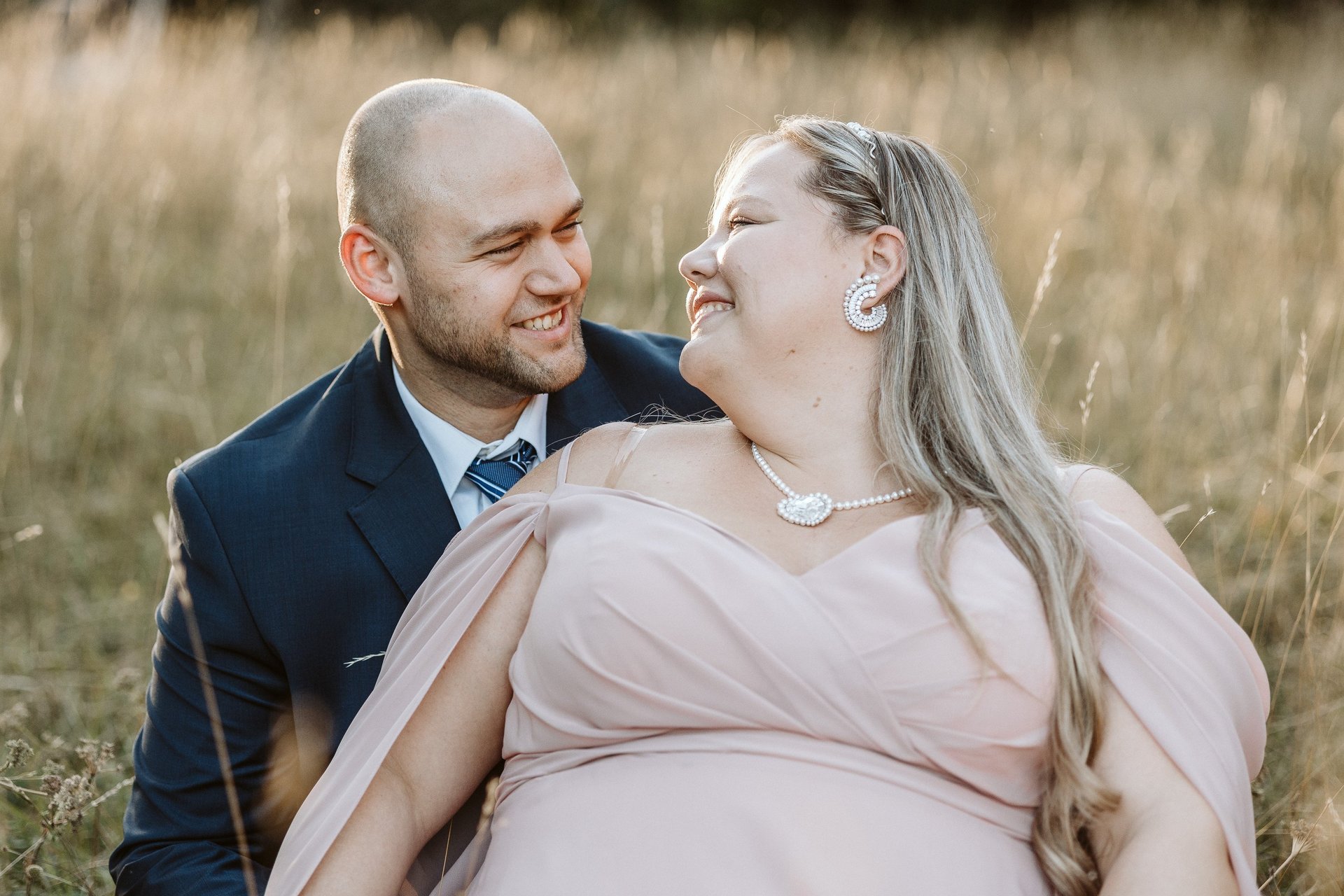 couple wearing silver-colored rings