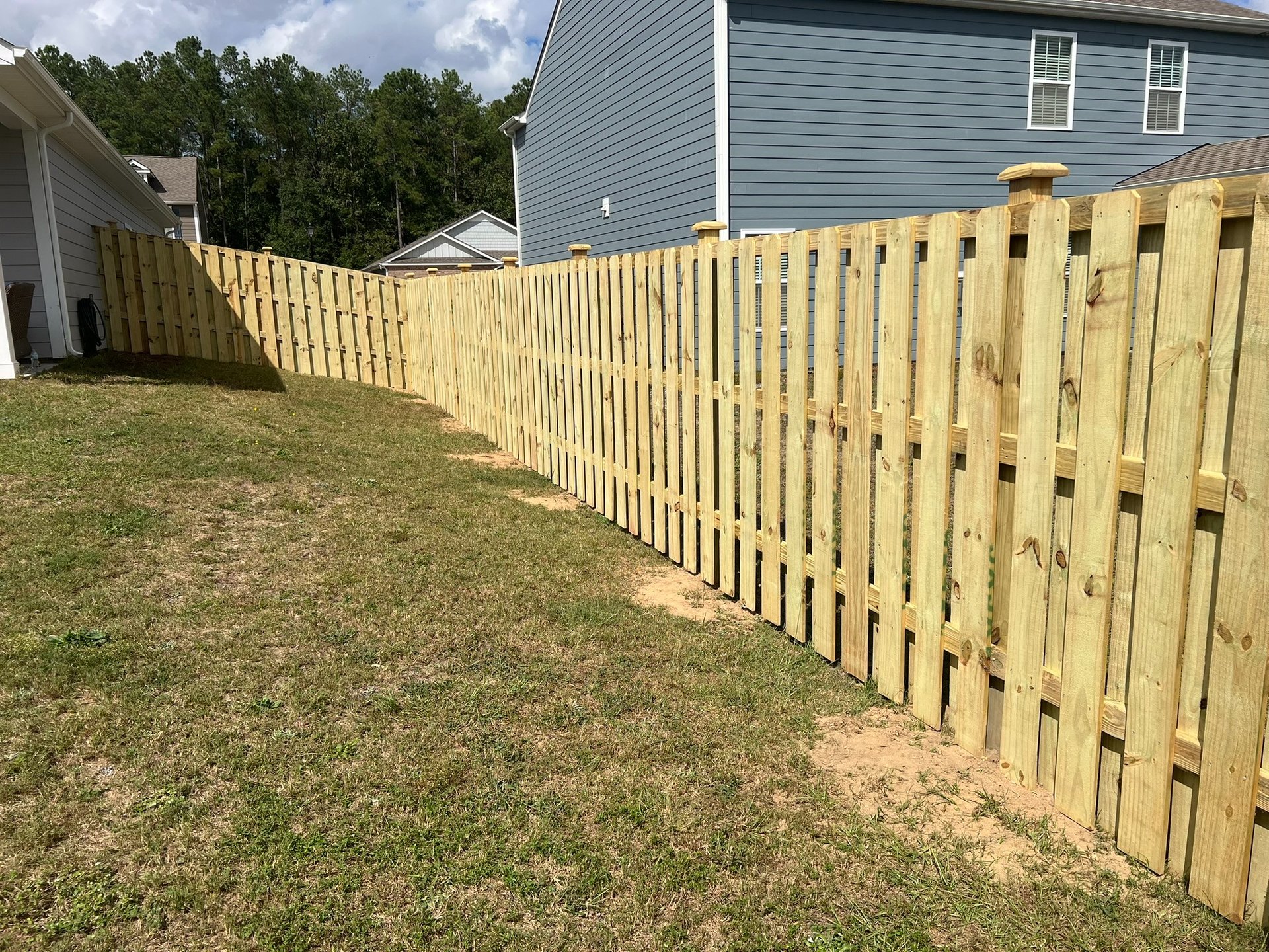 woman wearing yellow long-sleeved dress under white clouds and blue sky during daytime