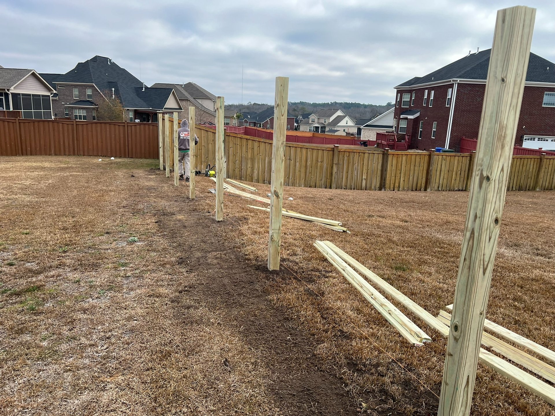 woman wearing yellow long-sleeved dress under white clouds and blue sky during daytime
