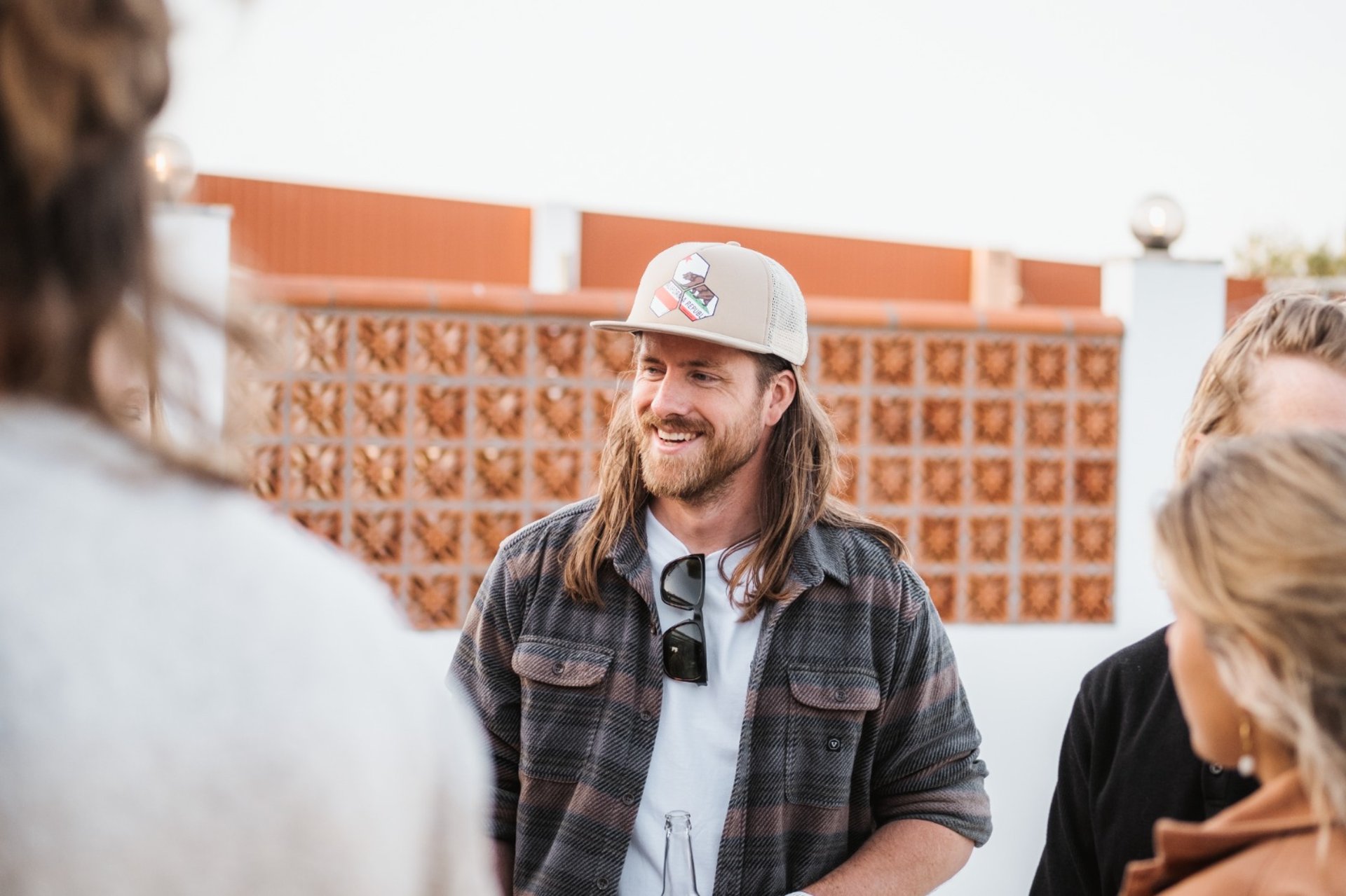 woman wearing yellow long-sleeved dress under white clouds and blue sky during daytime