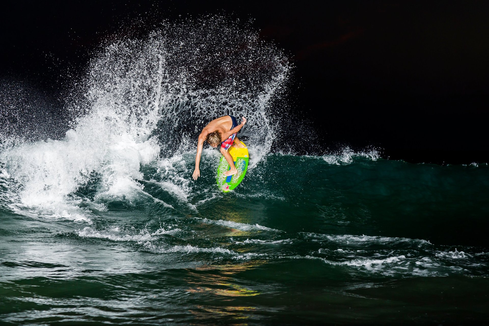 an abstract photo of a curved building with a blue sky in the background