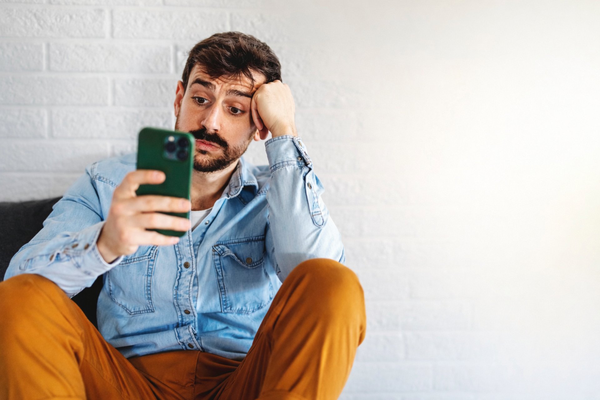 black and brown leather padded tub sofa
