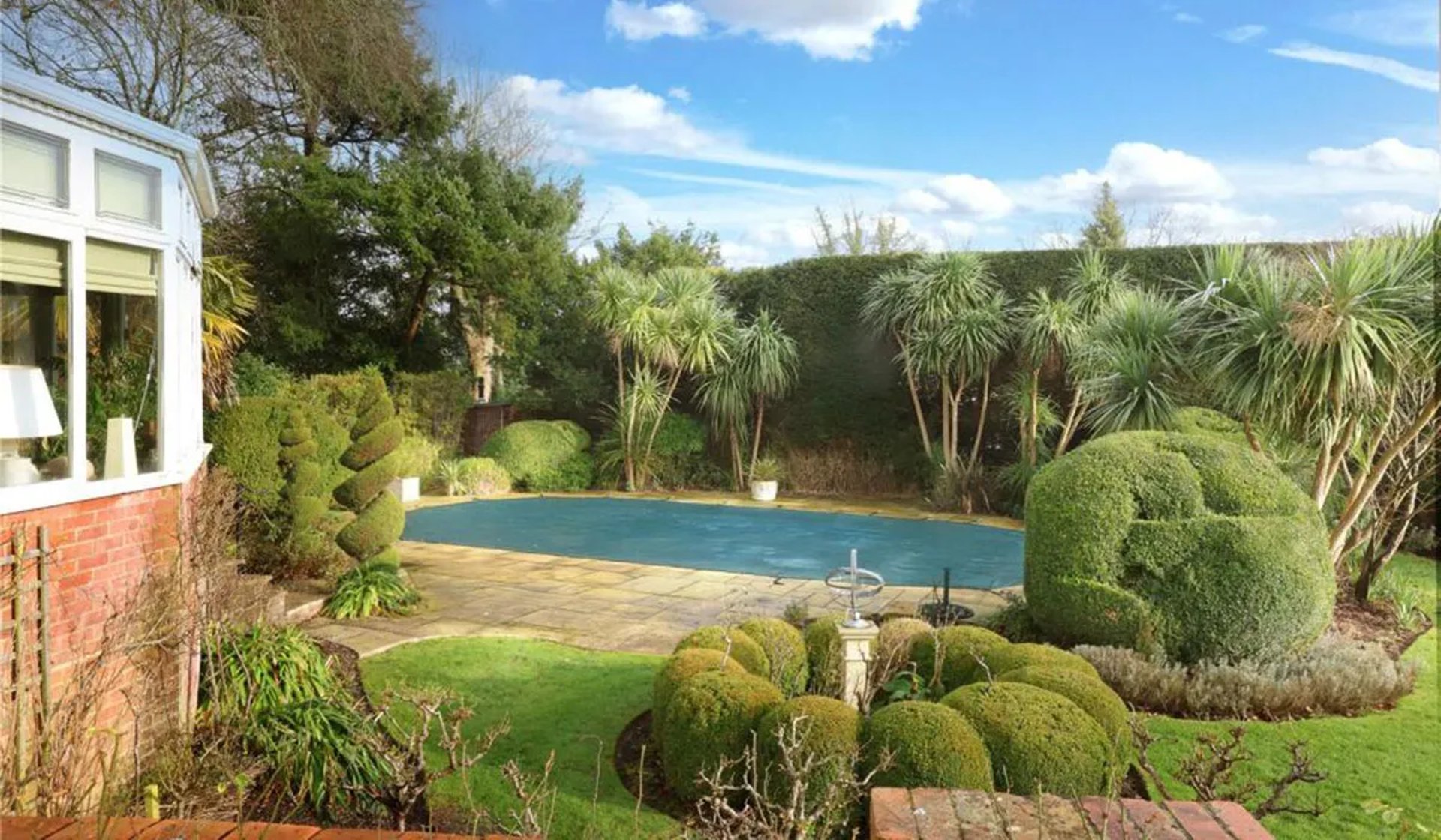 a tray of food sitting on the edge of a pool