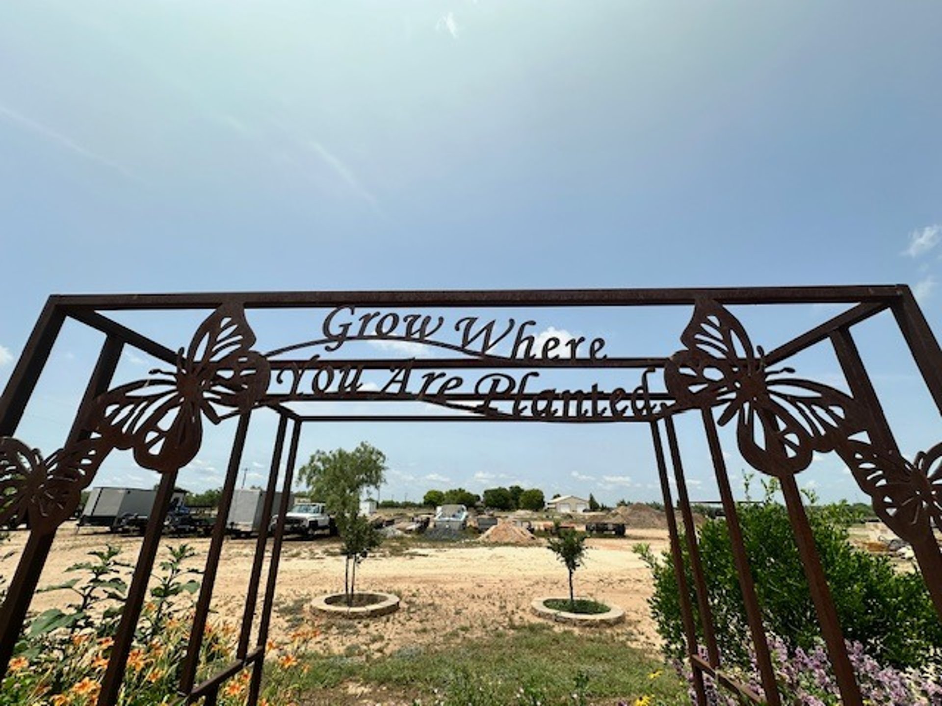 woman wearing yellow long-sleeved dress under white clouds and blue sky during daytime