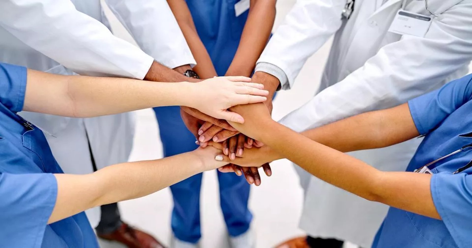 an abstract photo of a curved building with a blue sky in the background