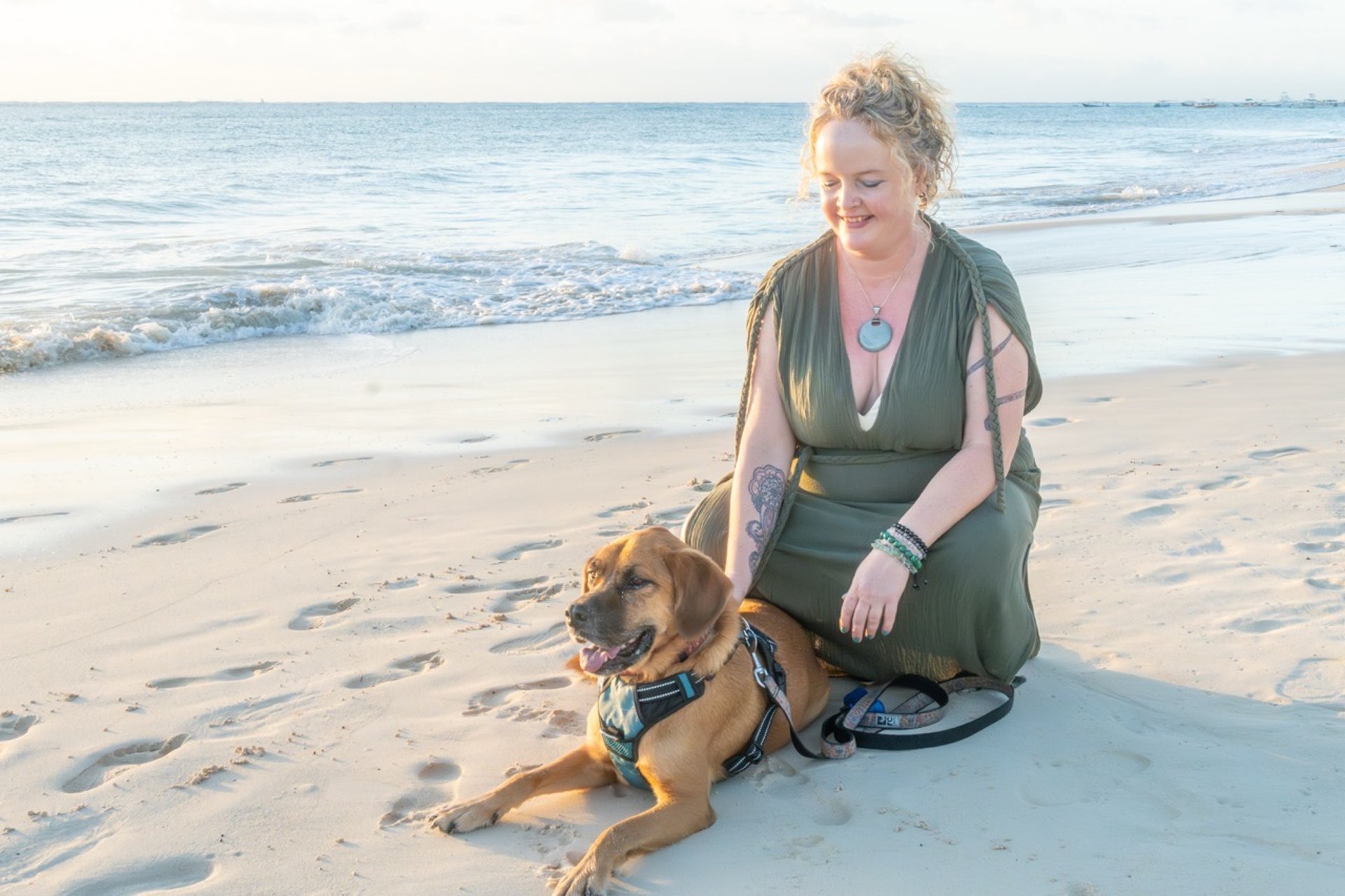 woman wearing yellow long-sleeved dress under white clouds and blue sky during daytime