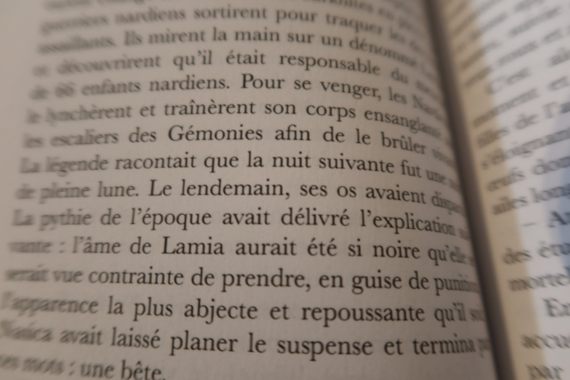 an abstract photo of a curved building with a blue sky in the background