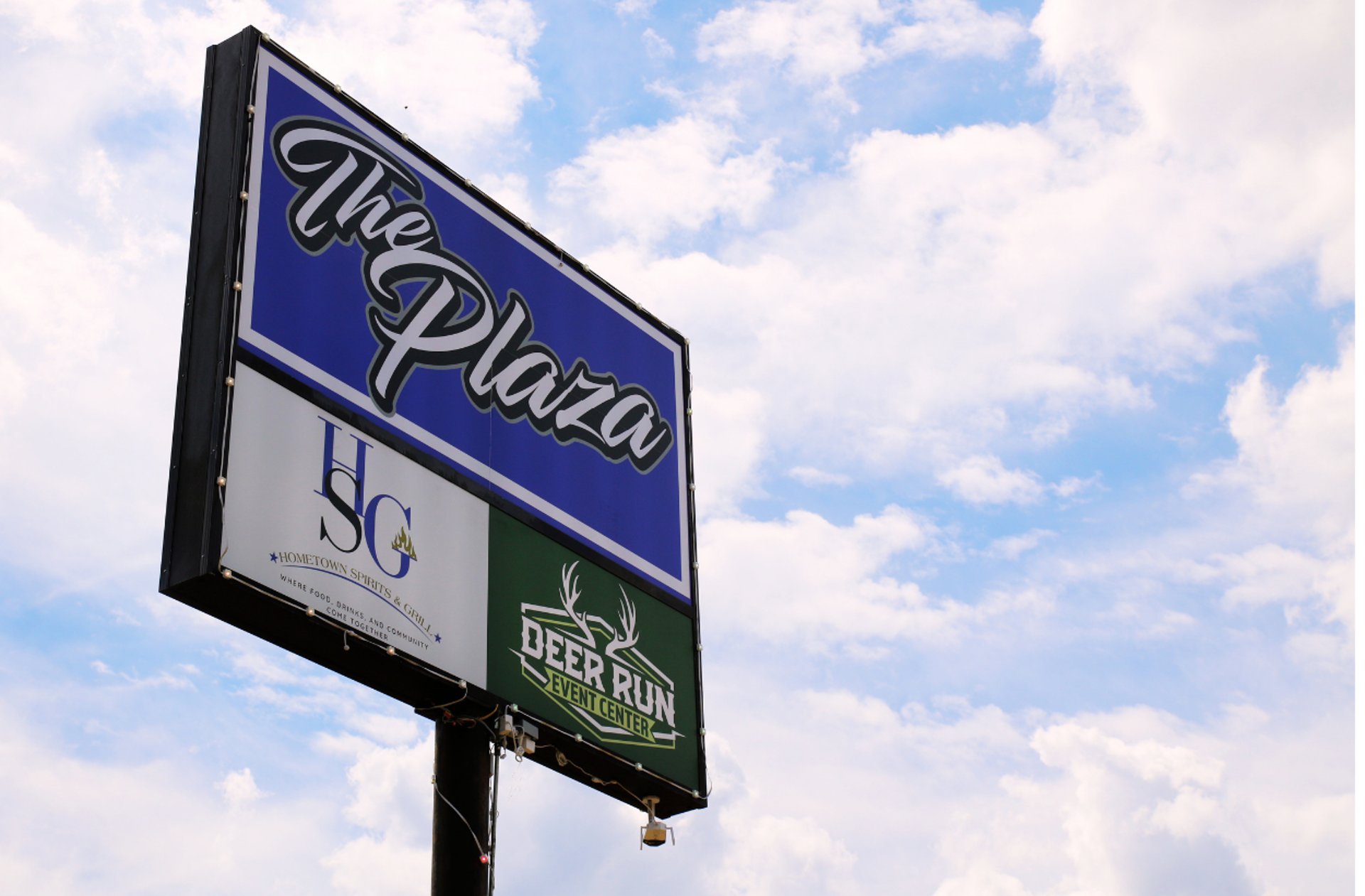 woman wearing yellow long-sleeved dress under white clouds and blue sky during daytime
