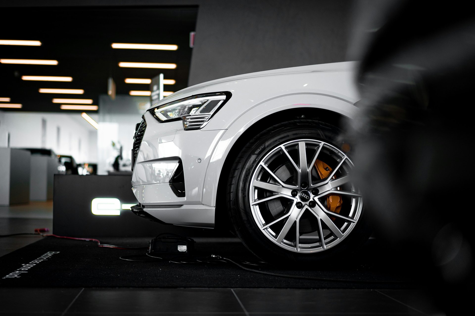 an abstract photo of a curved building with a blue sky in the background