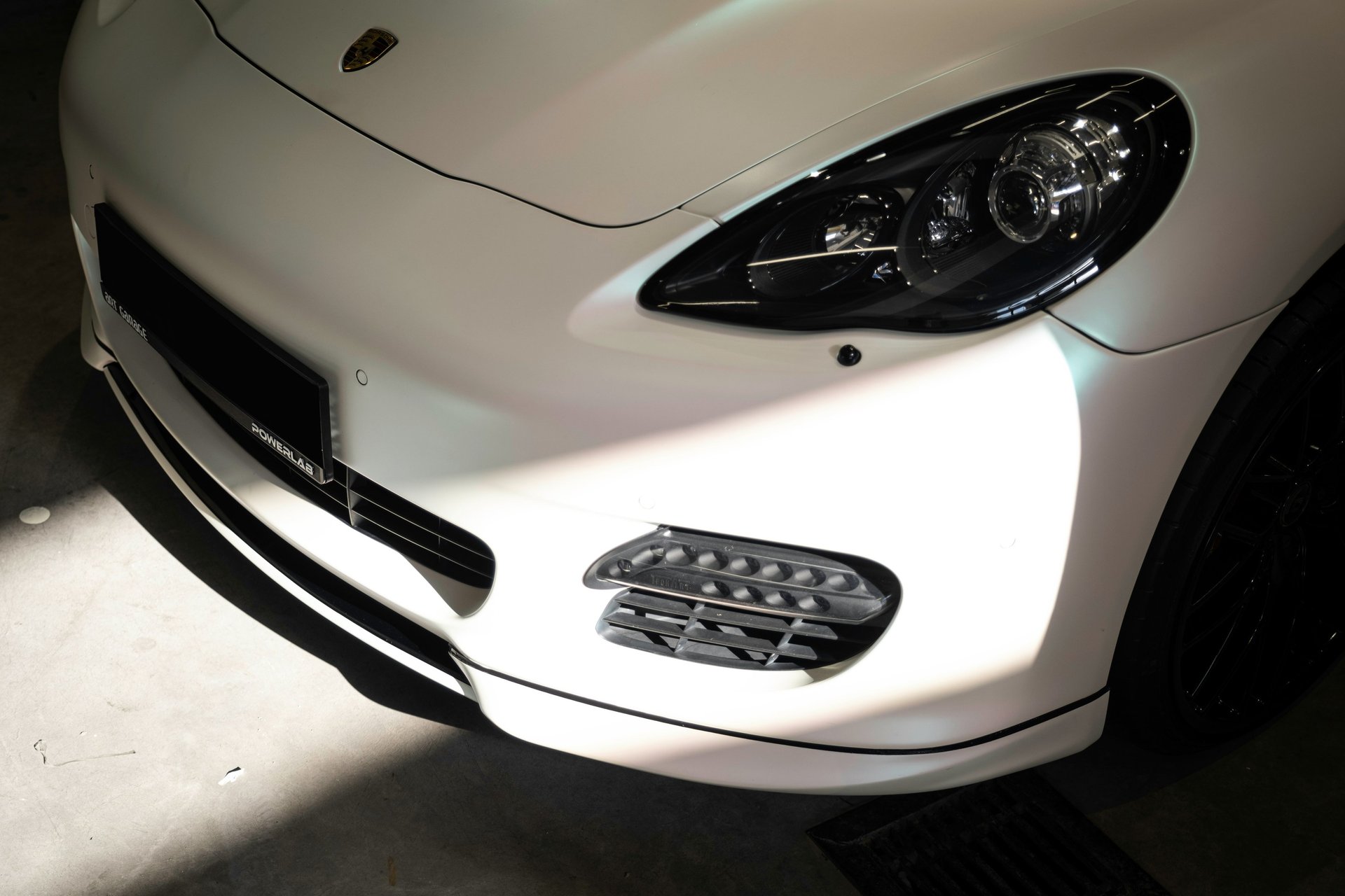 an abstract photo of a curved building with a blue sky in the background