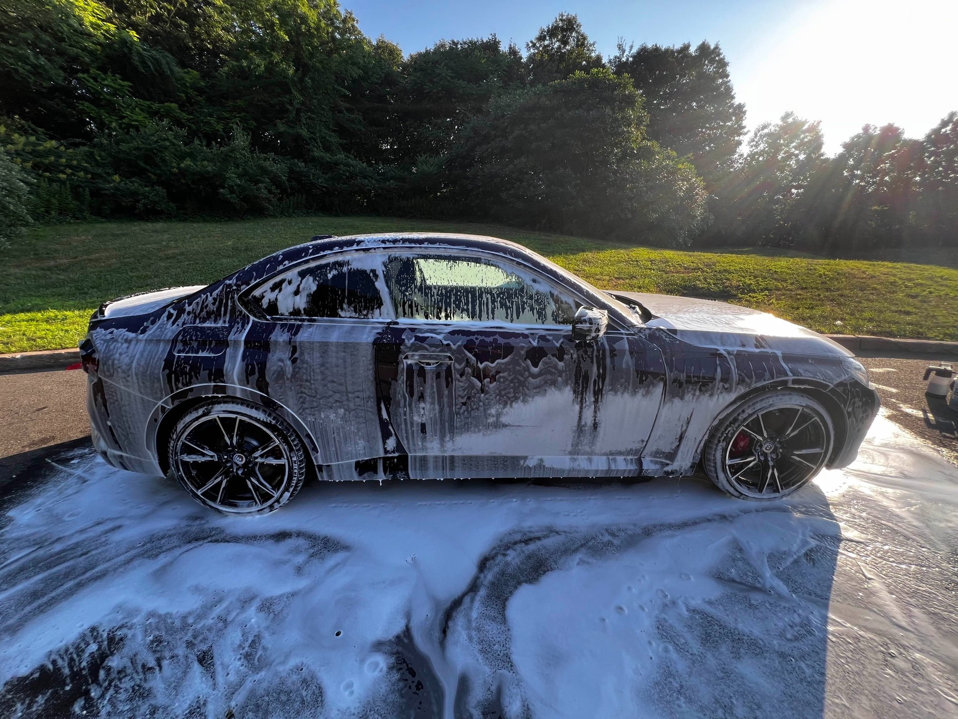 an abstract photo of a curved building with a blue sky in the background