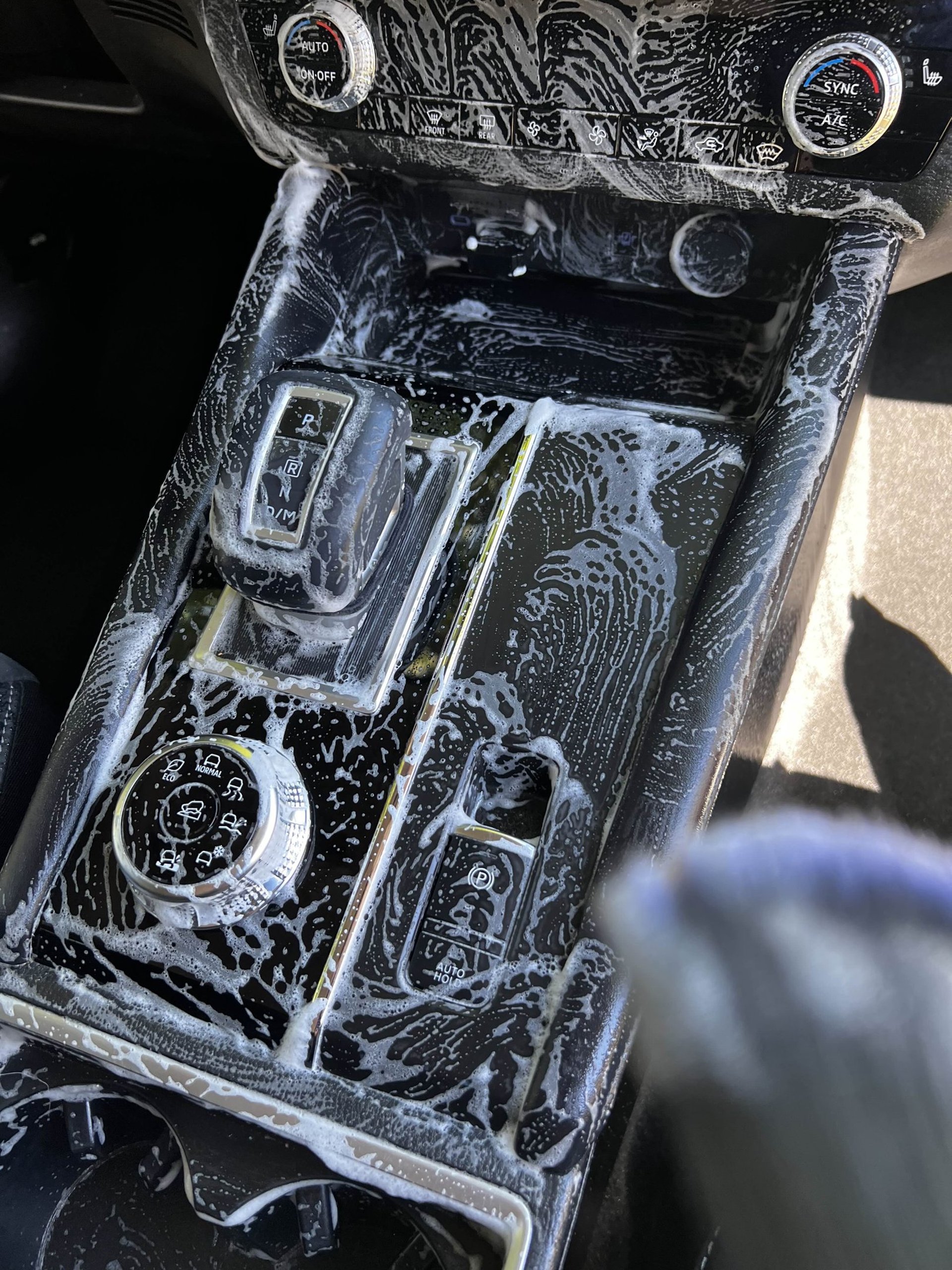 an abstract photo of a curved building with a blue sky in the background