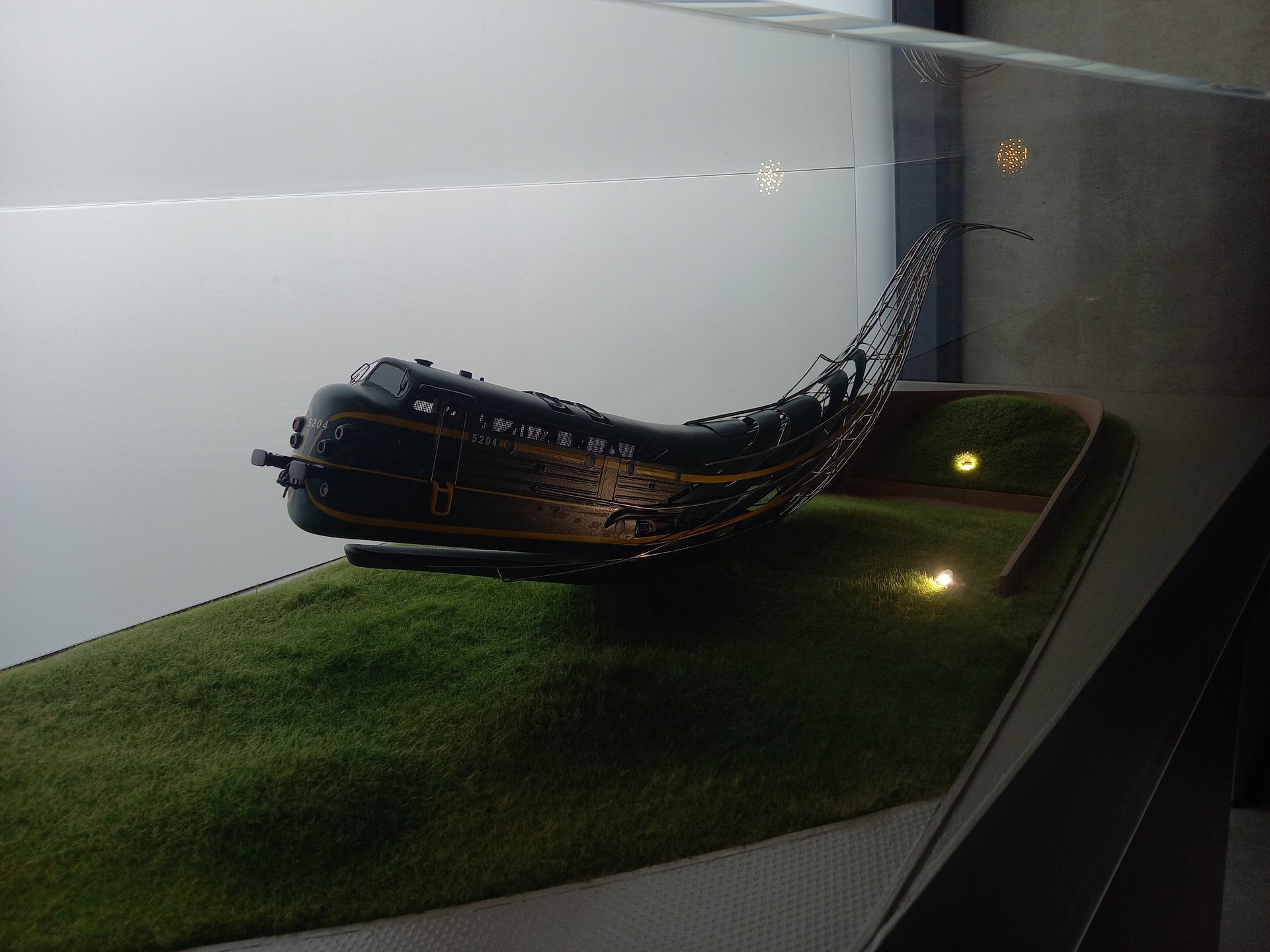 a narrow alley with a sign on the side of it