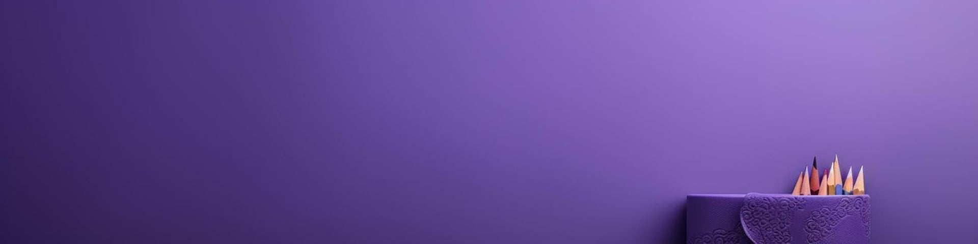 two pencils are sitting side by side on a purple surface