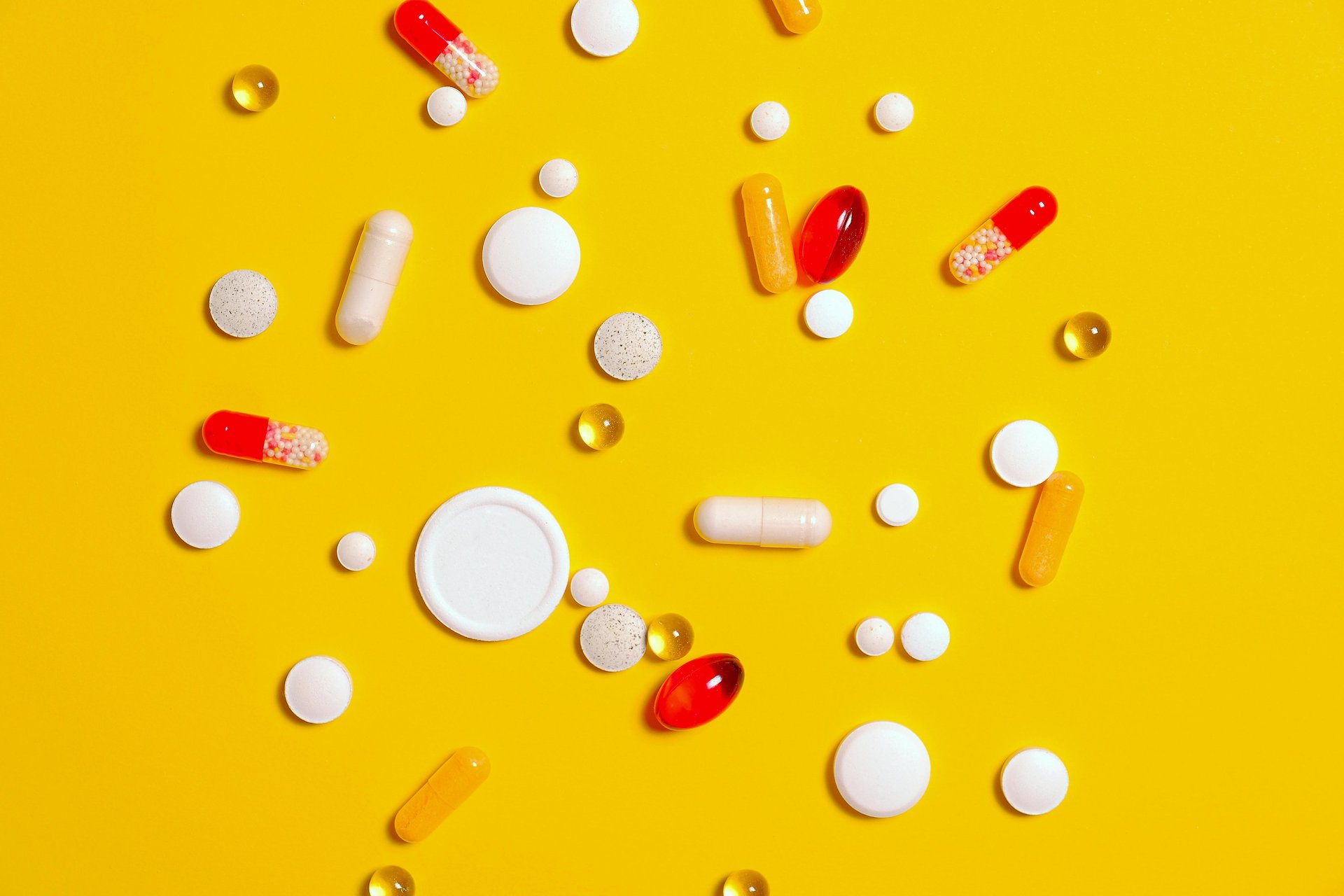white medication pill on green plastic container
