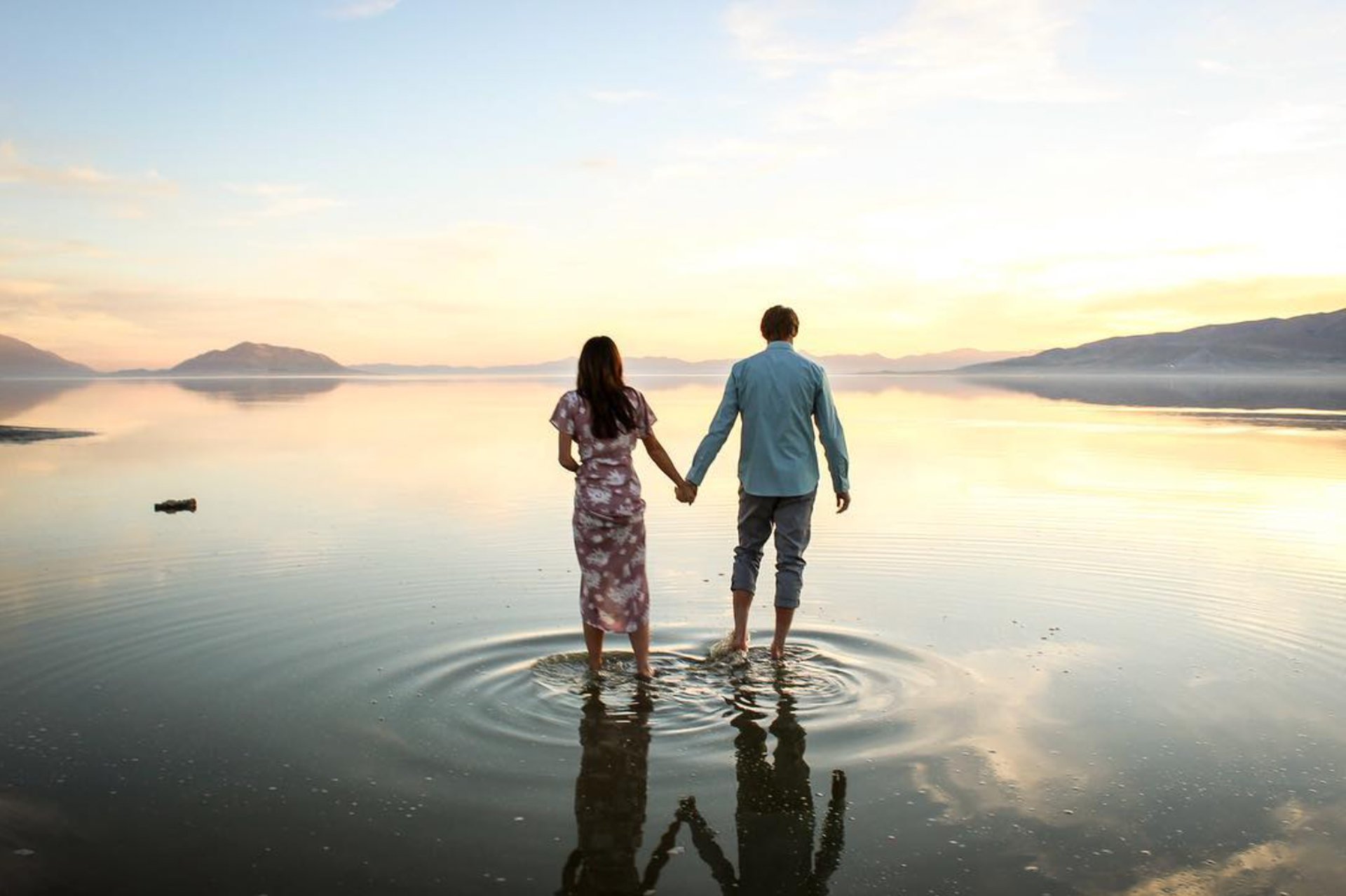 woman wearing yellow long-sleeved dress under white clouds and blue sky during daytime