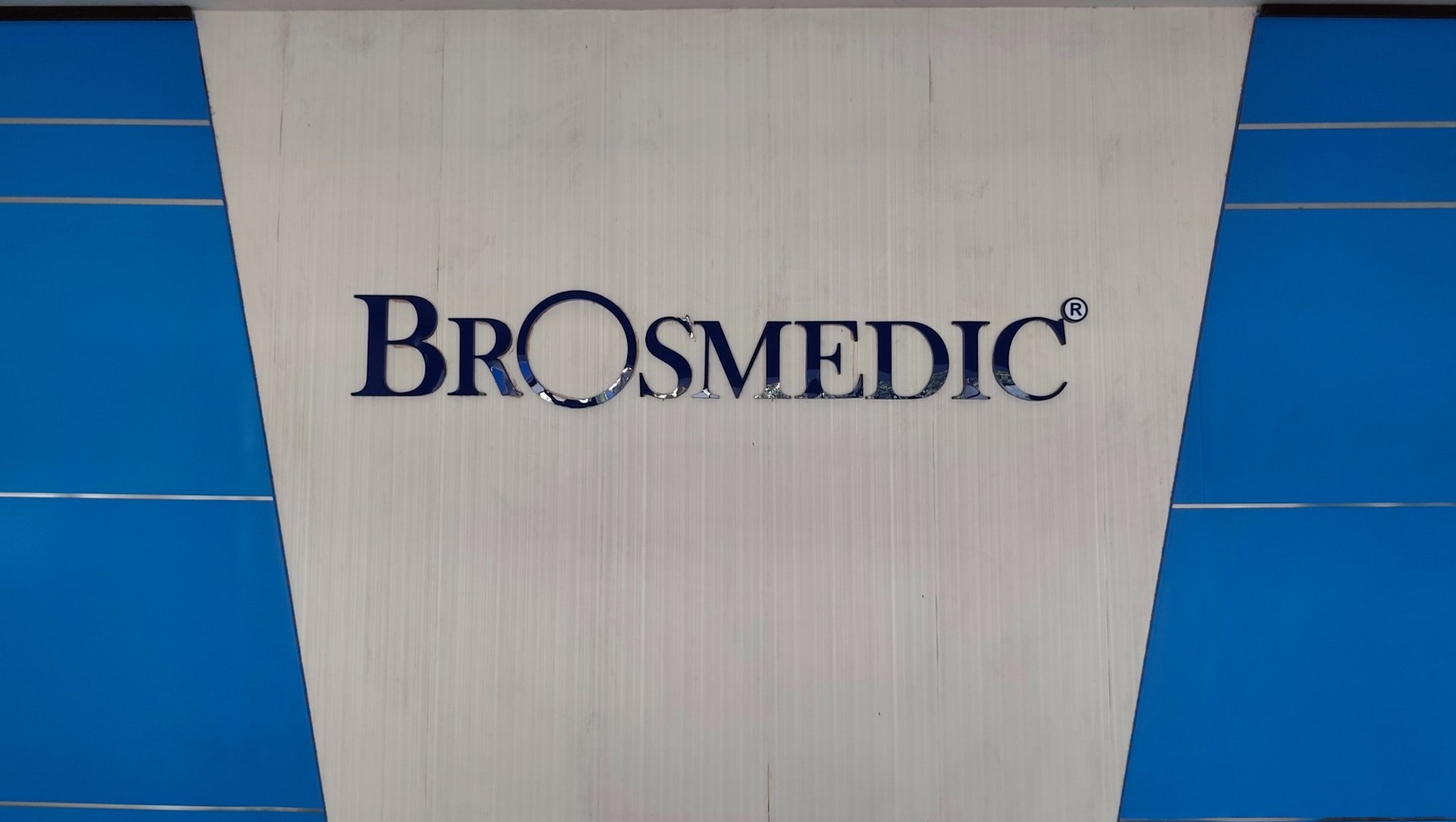 an abstract photo of a curved building with a blue sky in the background