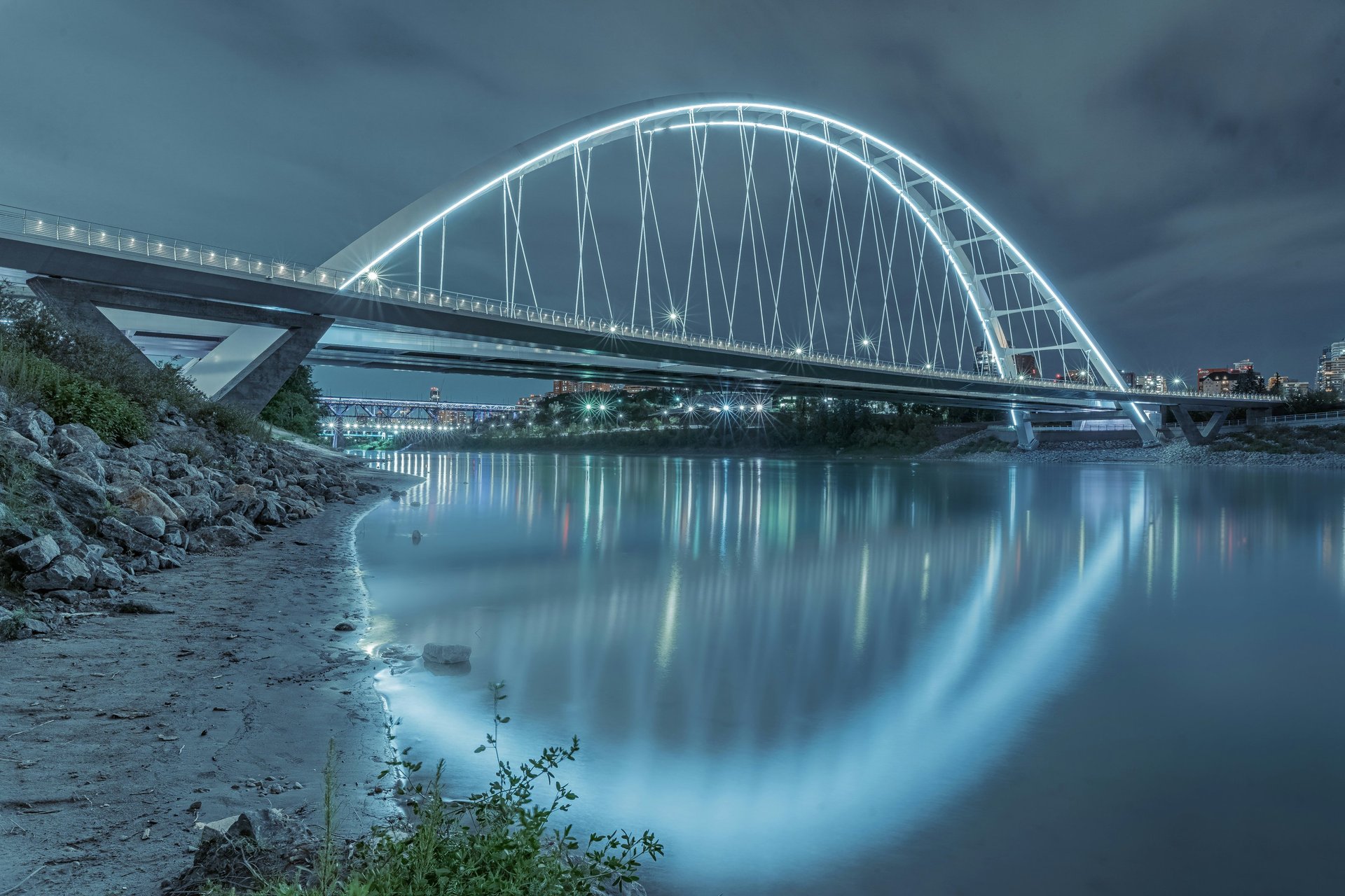 architectural photography of building with people in it during nighttime