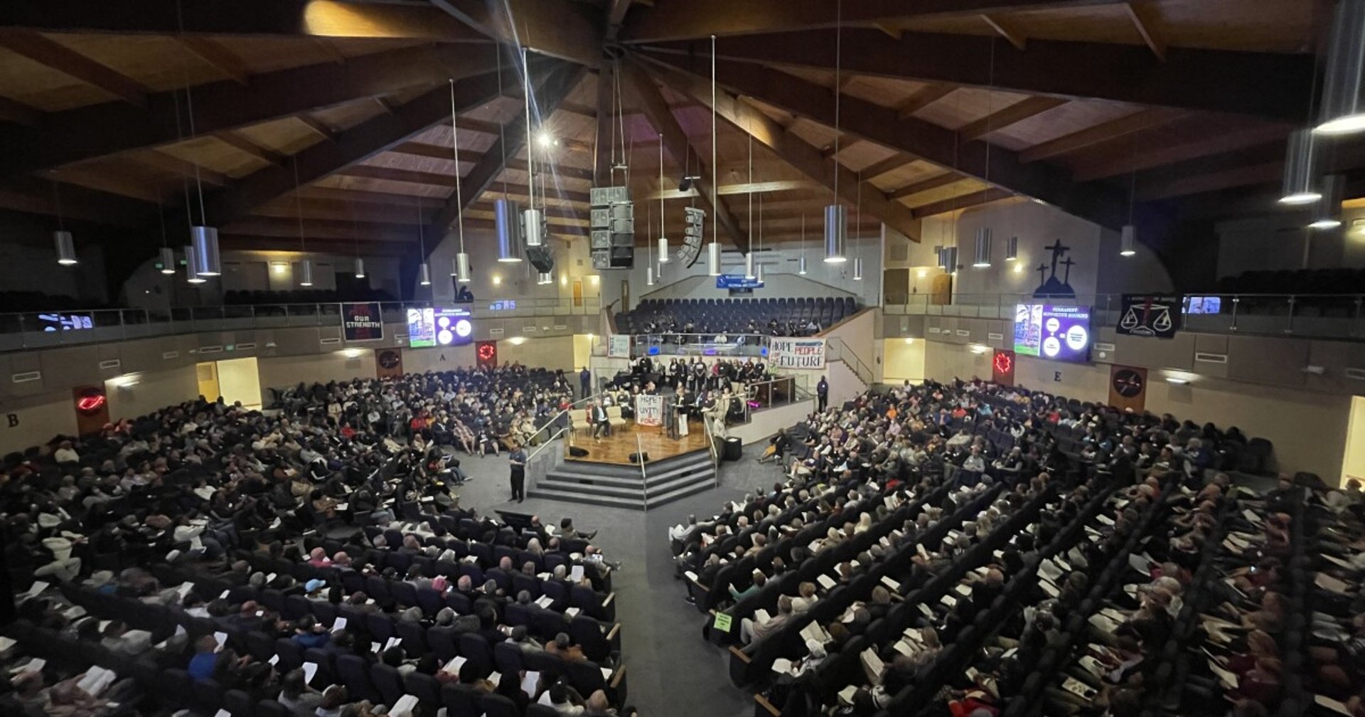 grayscale photo of people standing on stage