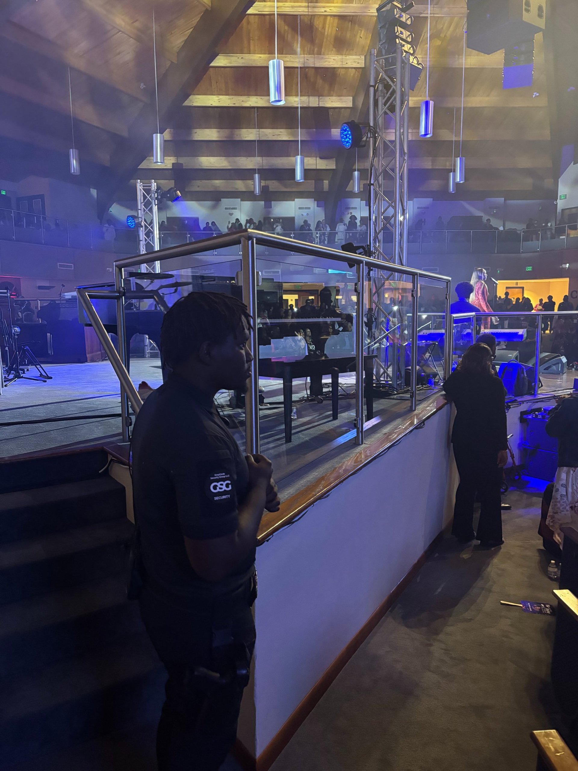 an abstract photo of a curved building with a blue sky in the background