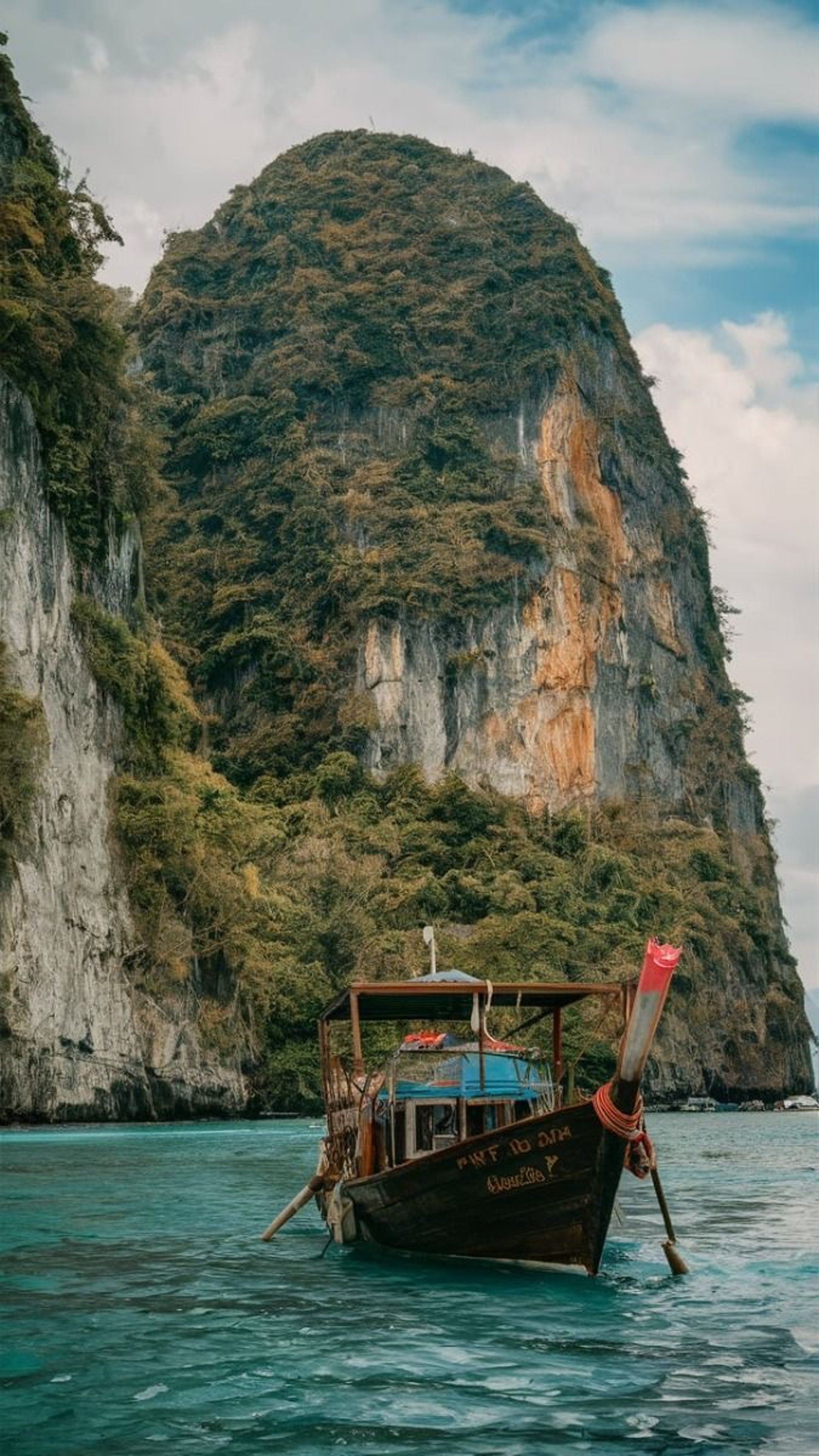 temple beside body of water and trees