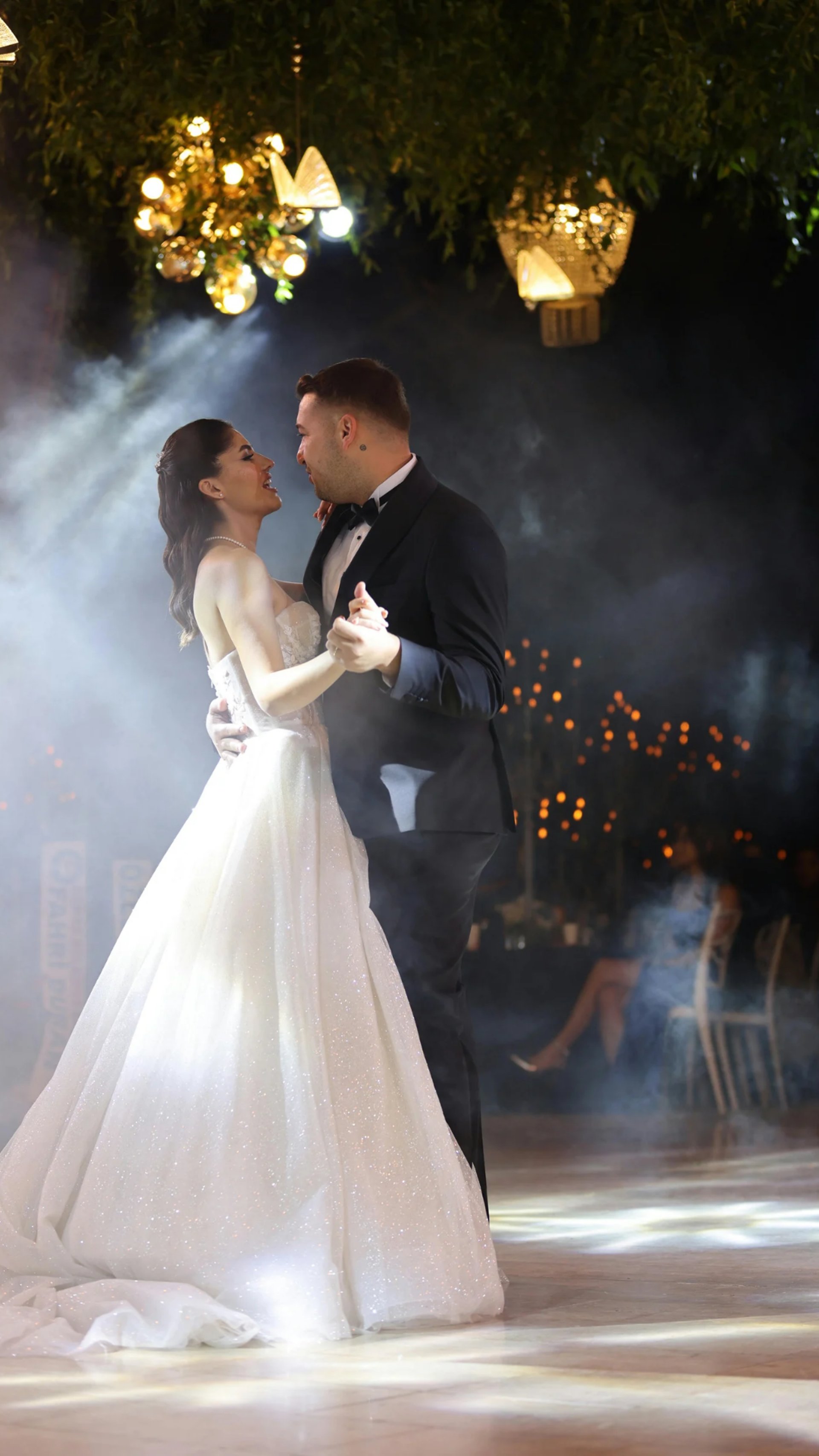bride and groom dancing on stage
