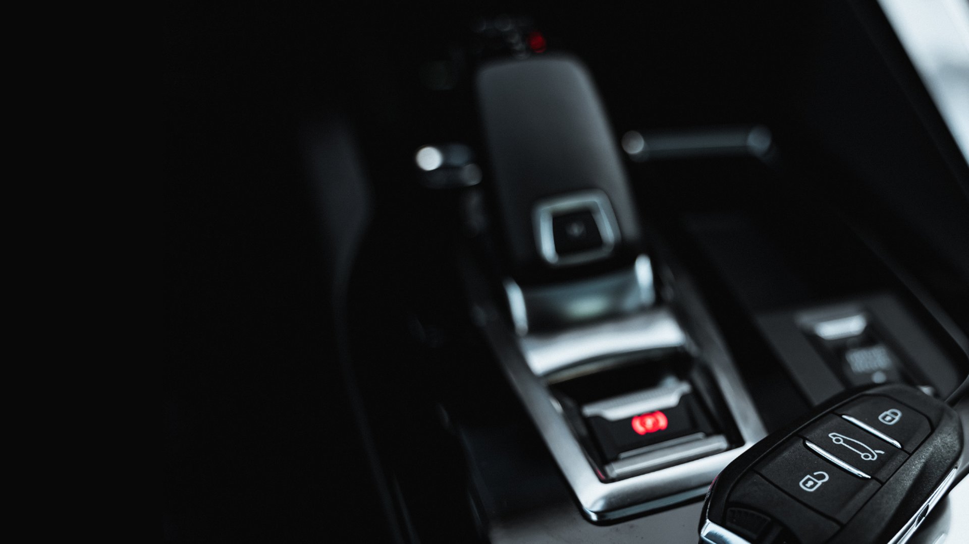 man driving a car wearing wrist watch