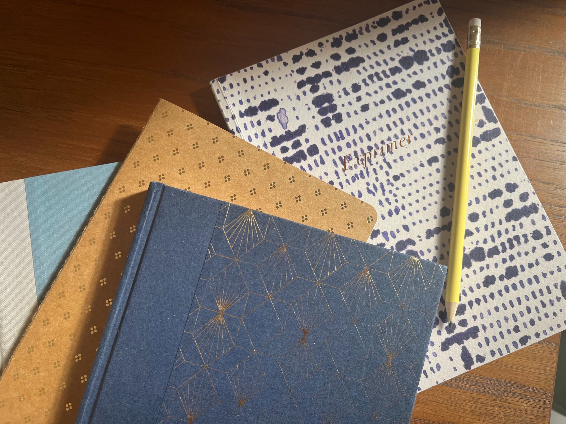 shallow focus photography of pencil on book