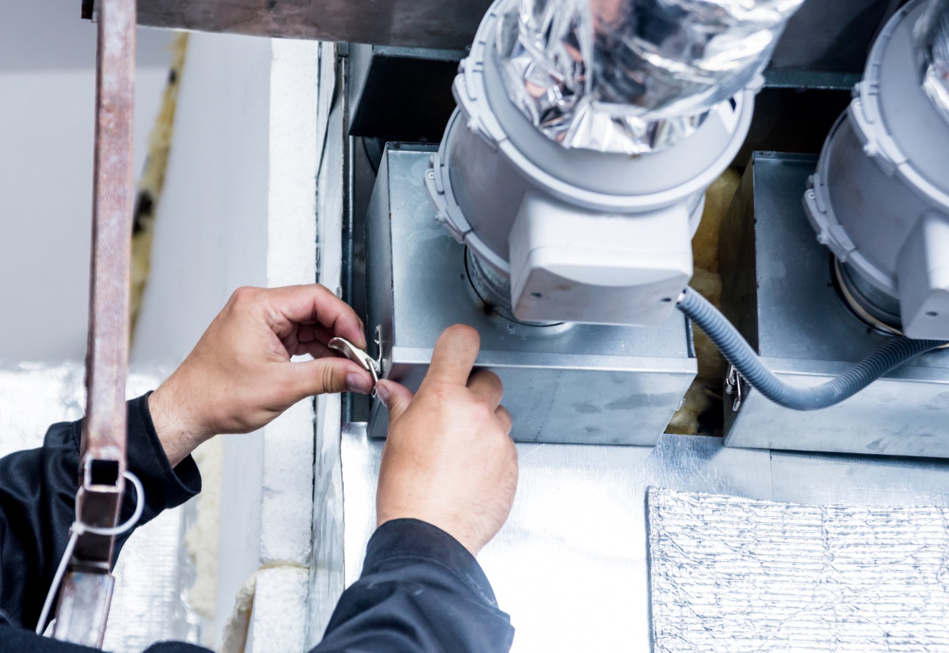 an abstract photo of a curved building with a blue sky in the background