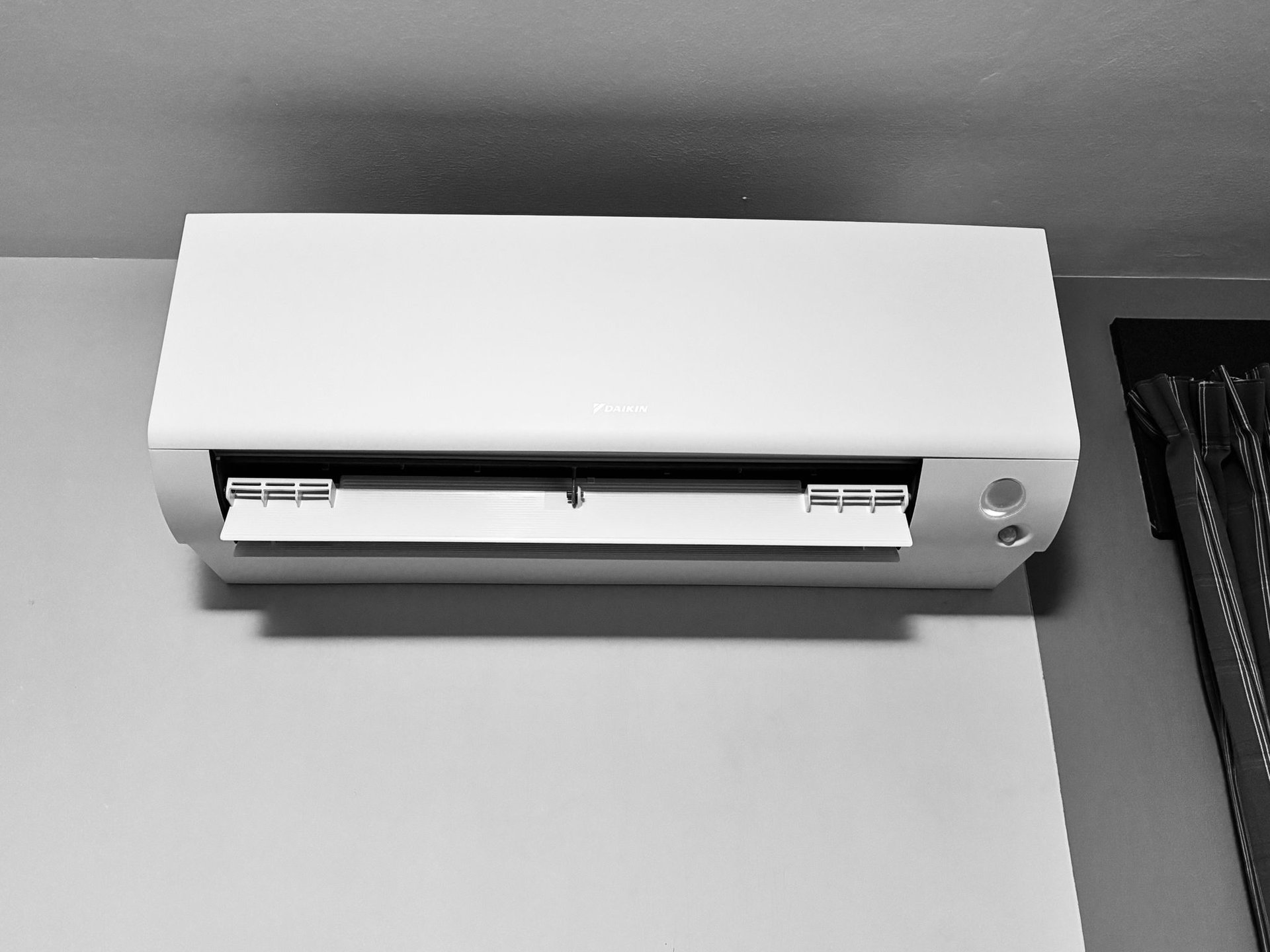 an abstract photo of a curved building with a blue sky in the background