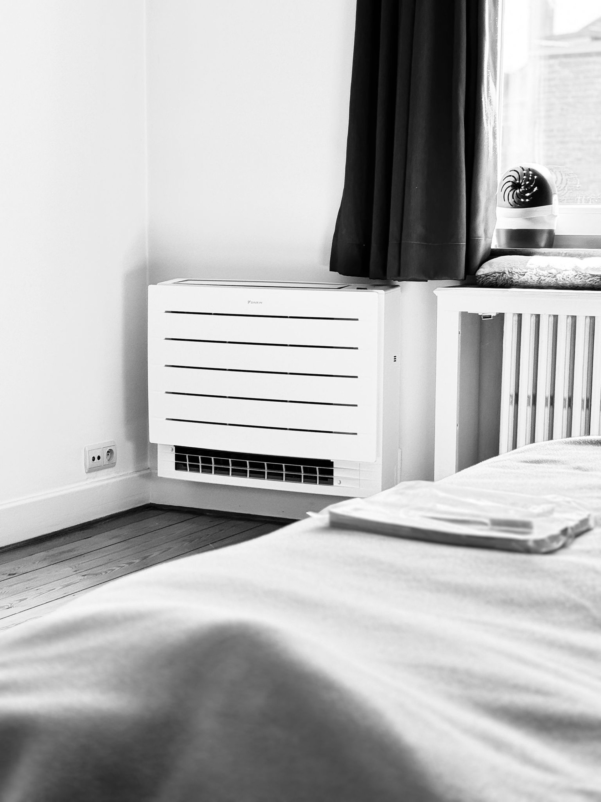 an abstract photo of a curved building with a blue sky in the background