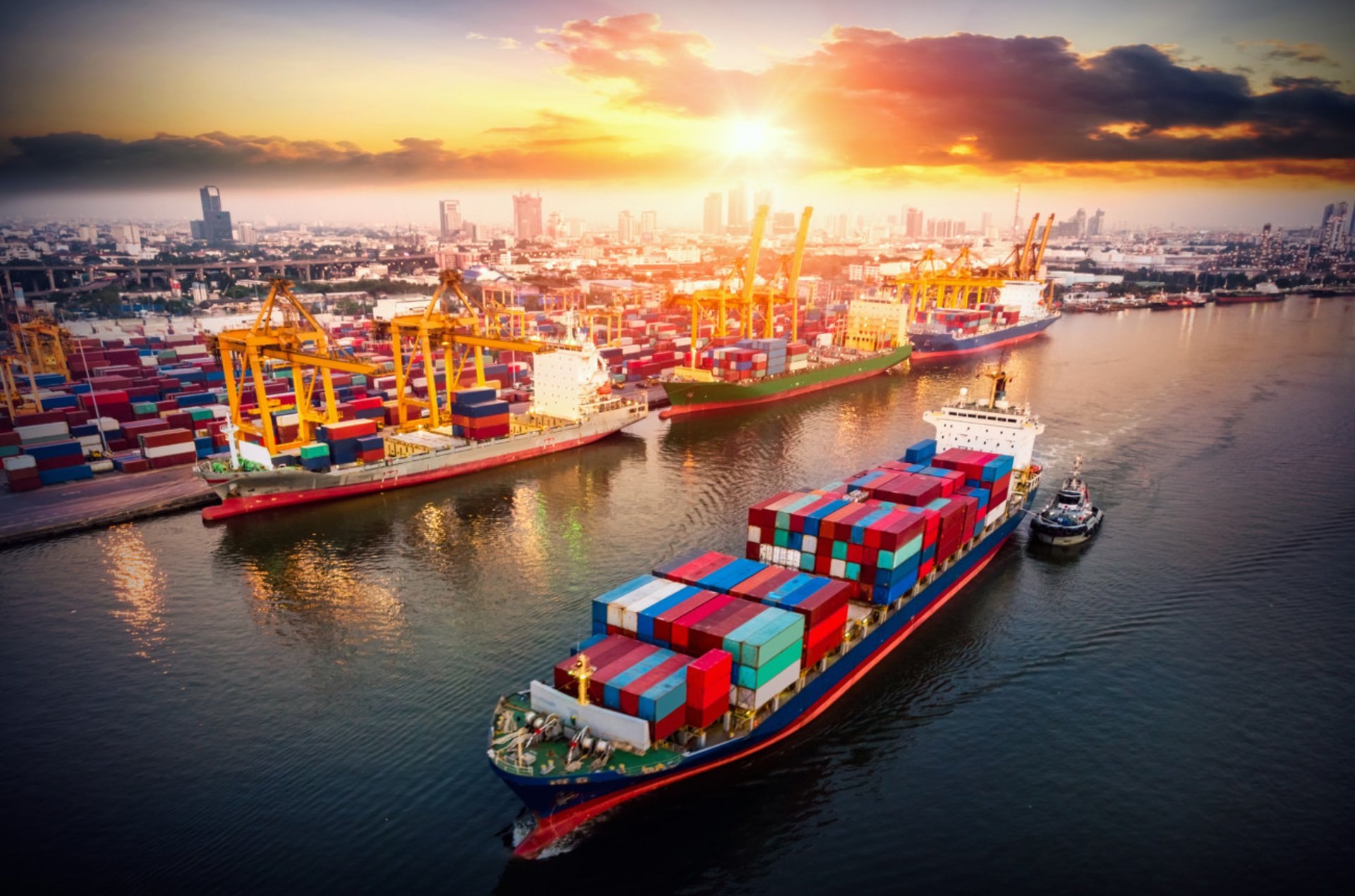 a man standing next to a waterfall covered in ice