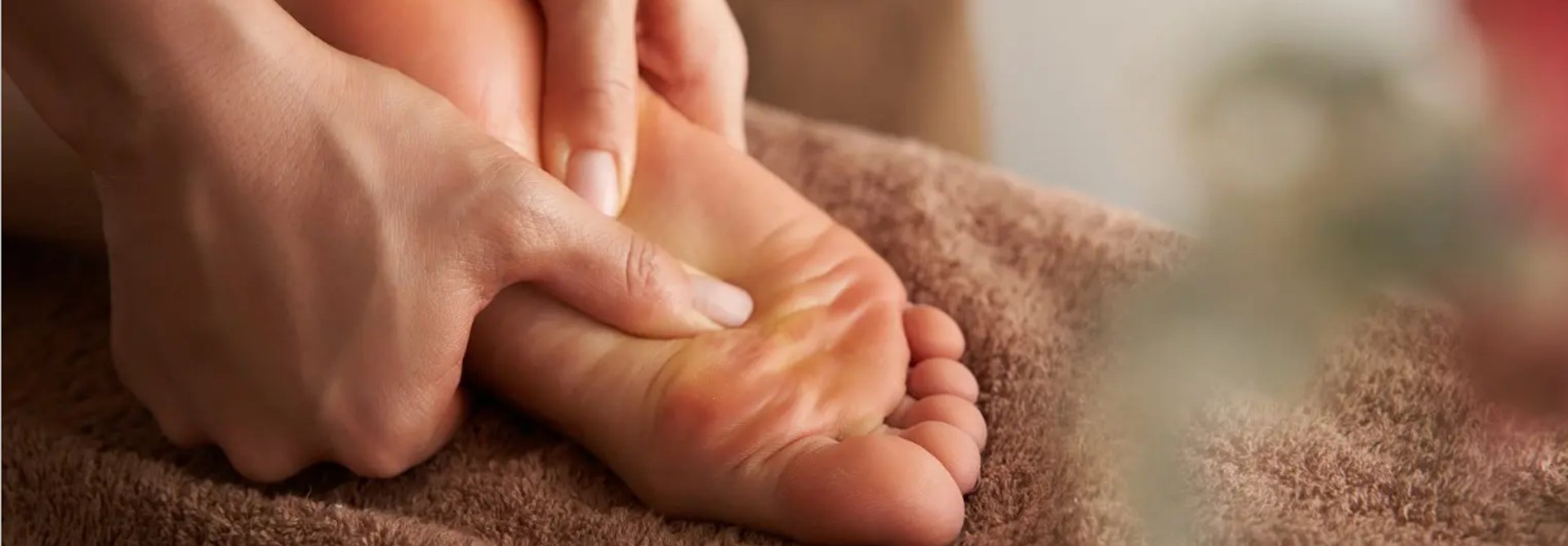 footprints in the sand of a beach at sunset