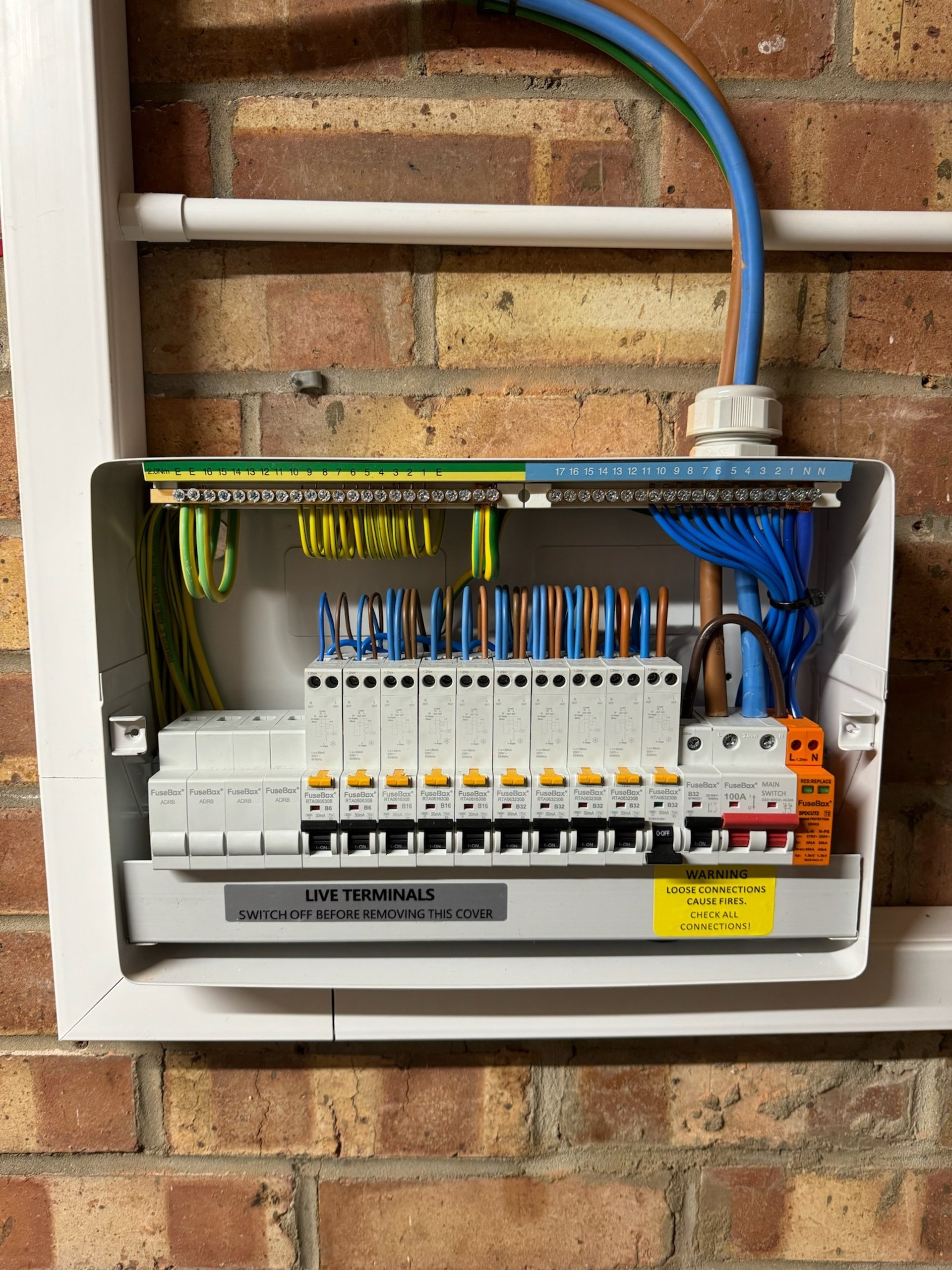 a black room with a white light coming from the ceiling