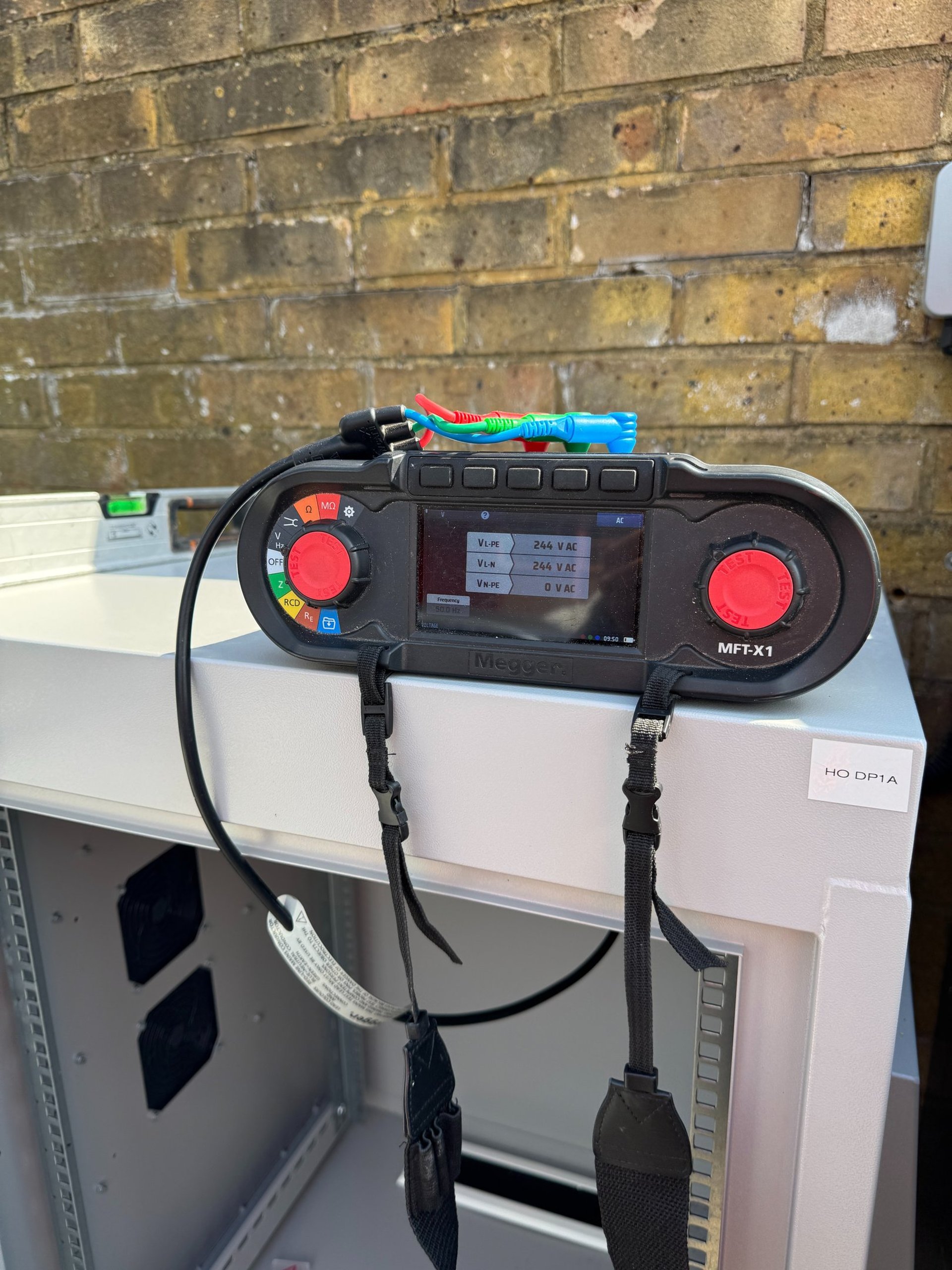 a black room with a white light coming from the ceiling