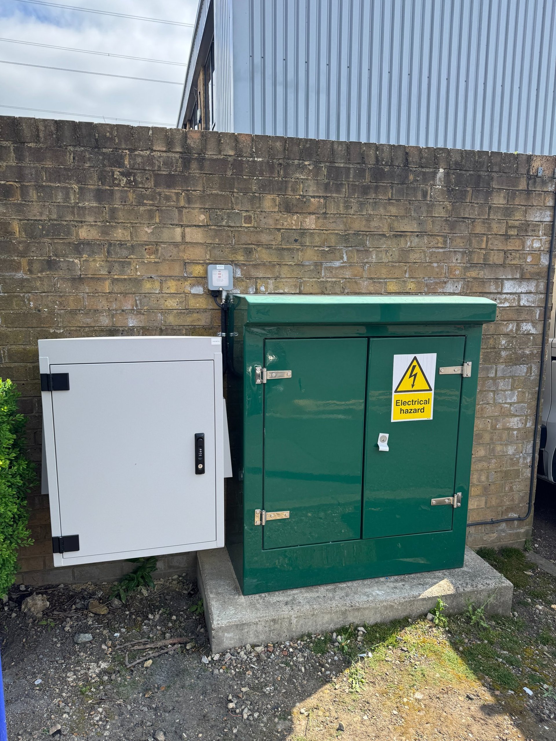 a black room with a white light coming from the ceiling